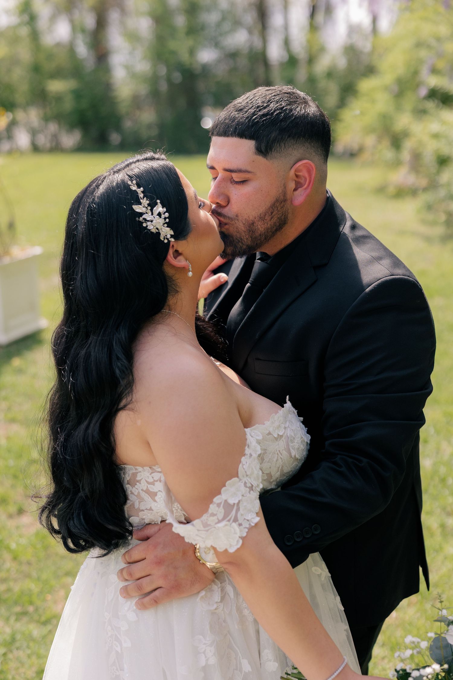 Intimate wedding portraits captured outdoors with beautiful spring foliage in the background.