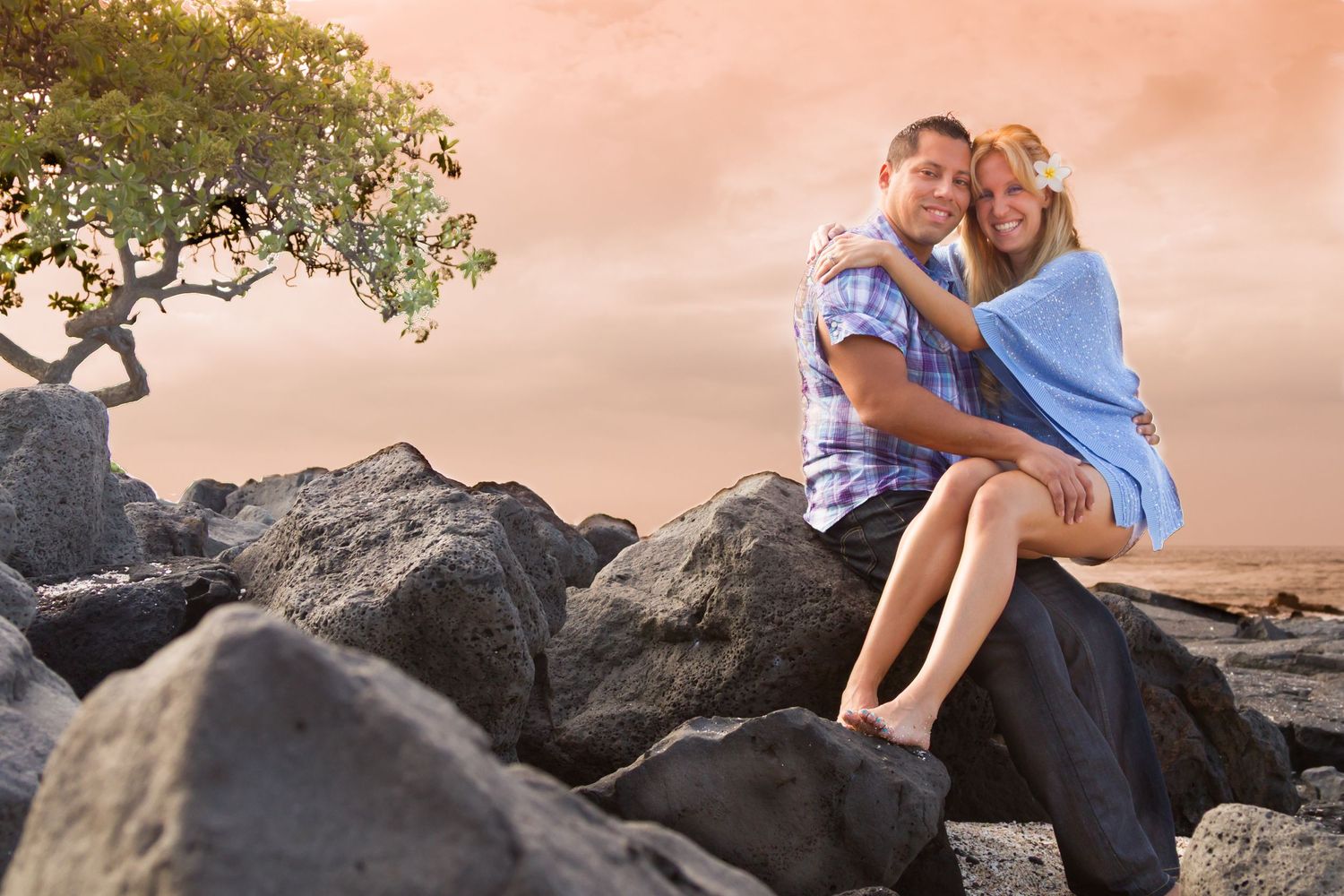 An engagement photo couple on a scenic Big Island coast at sunset, captured by a natural light photographer