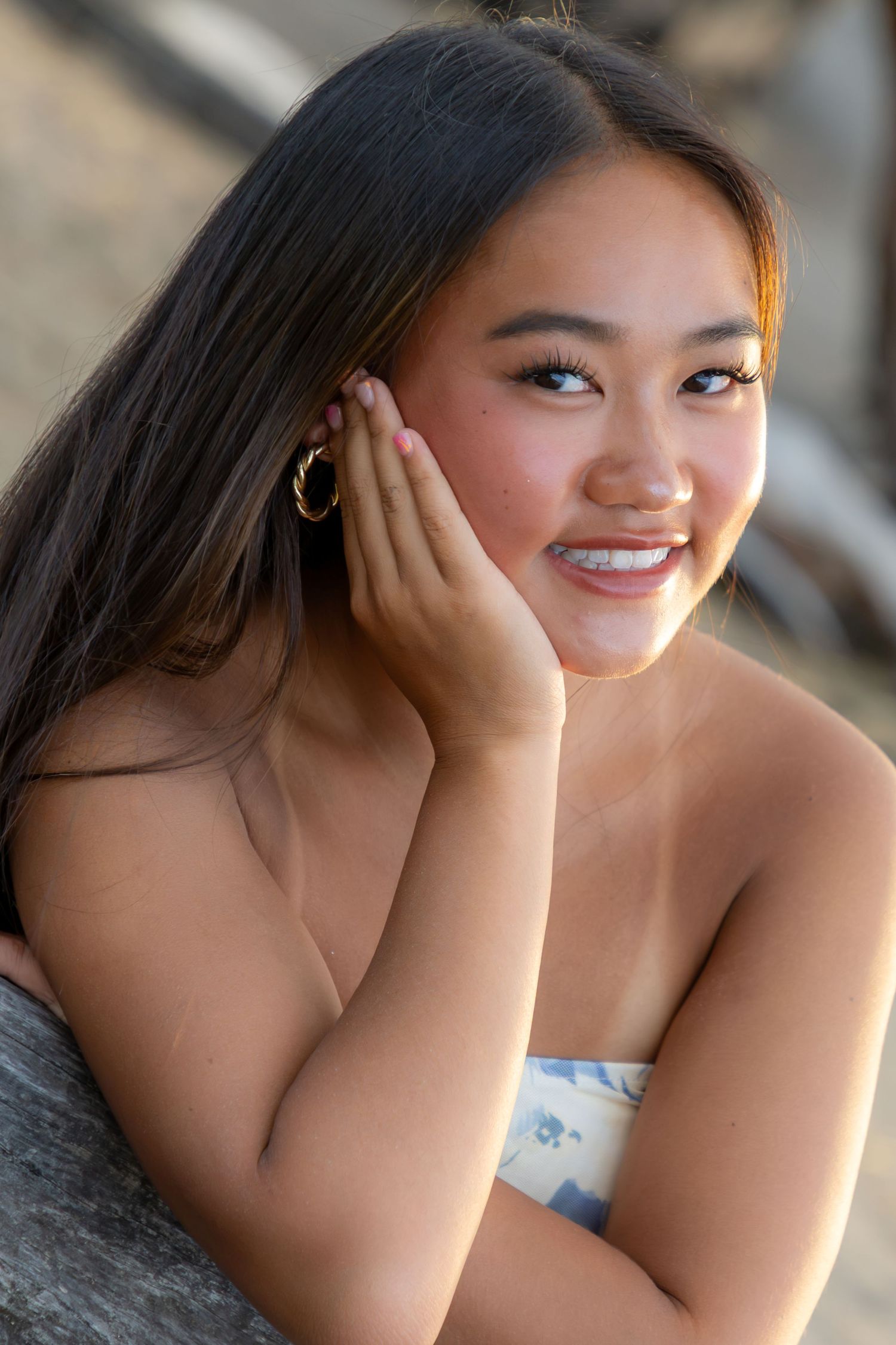 Close-up beach portrait of a young girl at Anaehoomalu Bay, captured by a Big Island portrait photographer. *