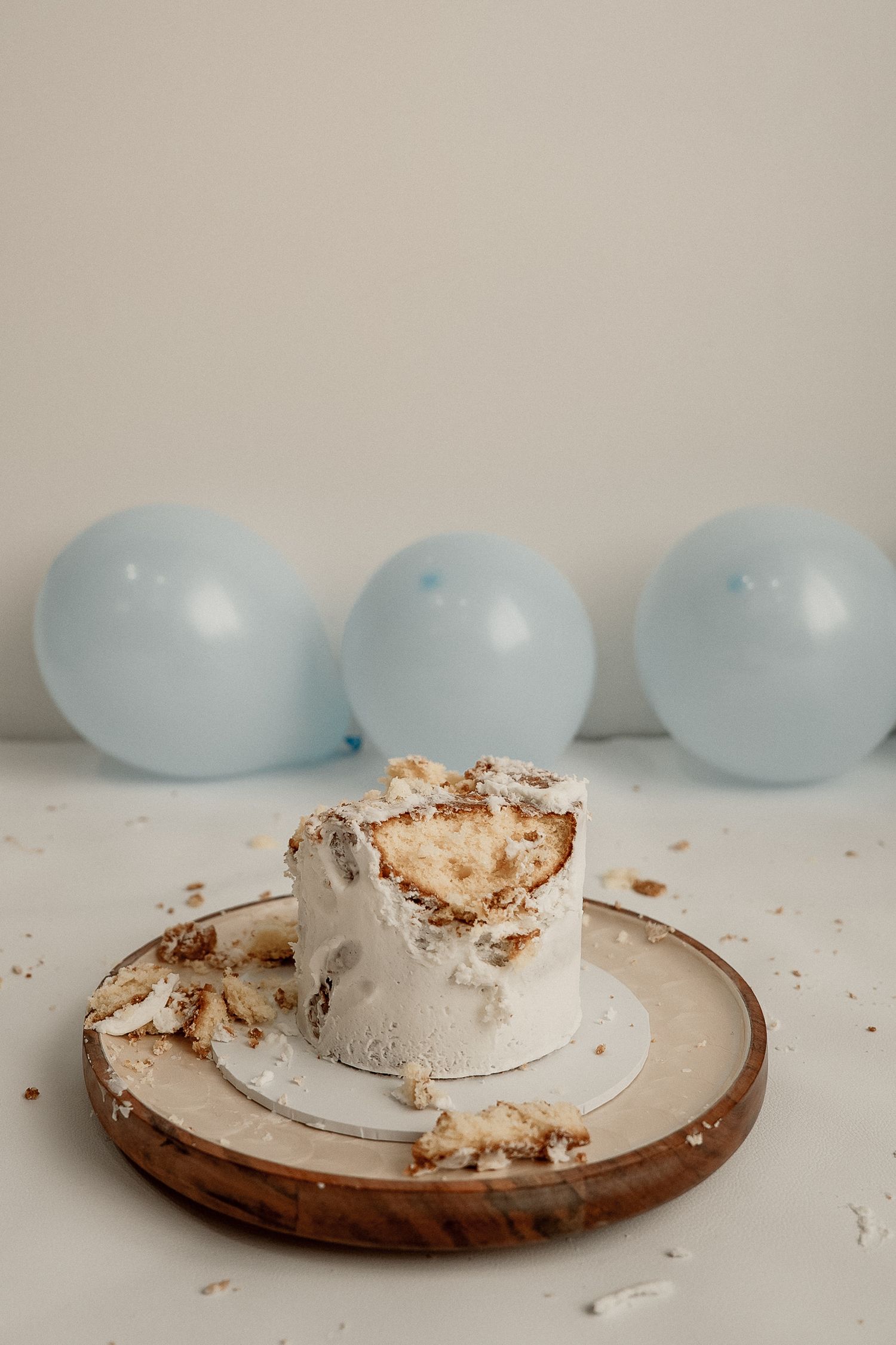A sequence of four images showing a ceramic plate with crumbled meringue next to pale blue eggs on a neutral background.