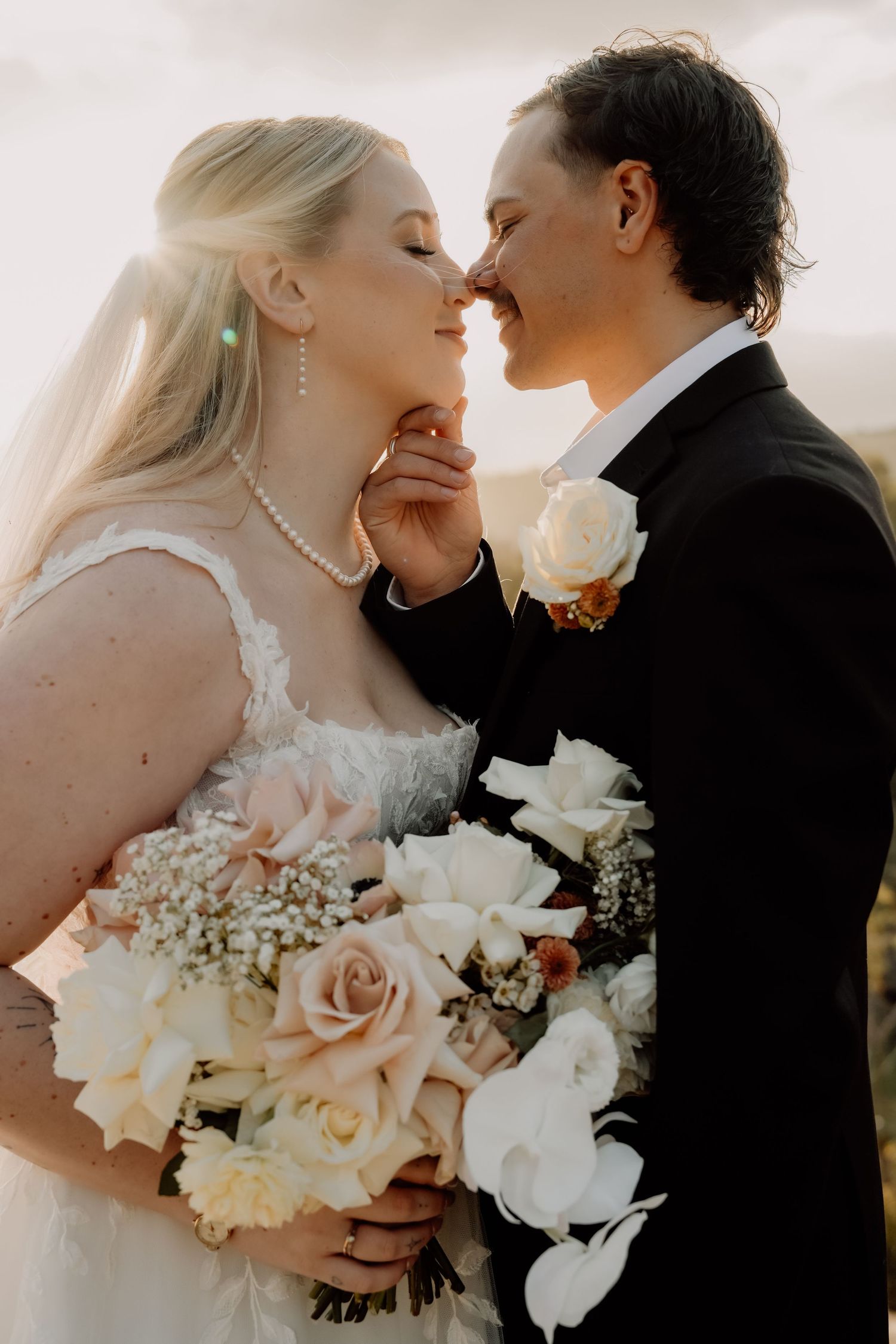 A romantic wedding photoshoot series showing tender moments between a bride and groom with white floral bouquet details.
