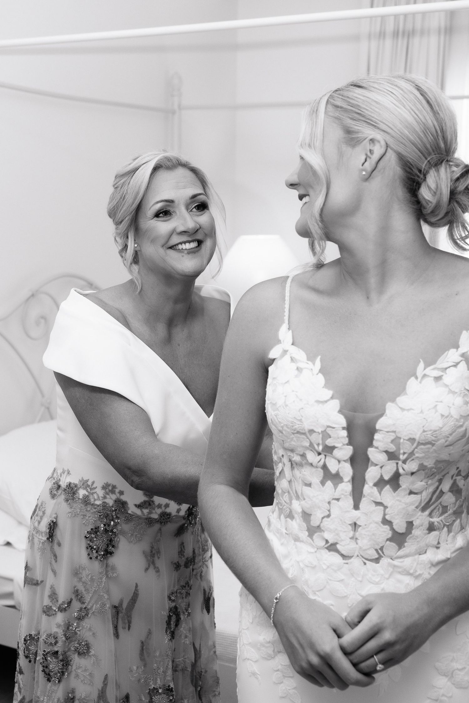 A series of black and white photos showing tender moments between two people in formal attire.