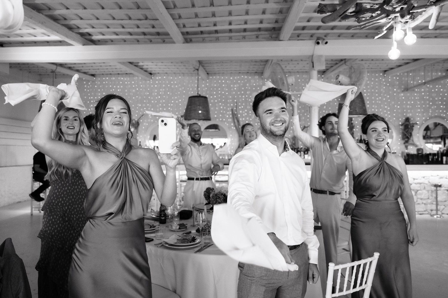 A sequence of black and white photographs showing people dancing together at what appears to be a social gathering or party.