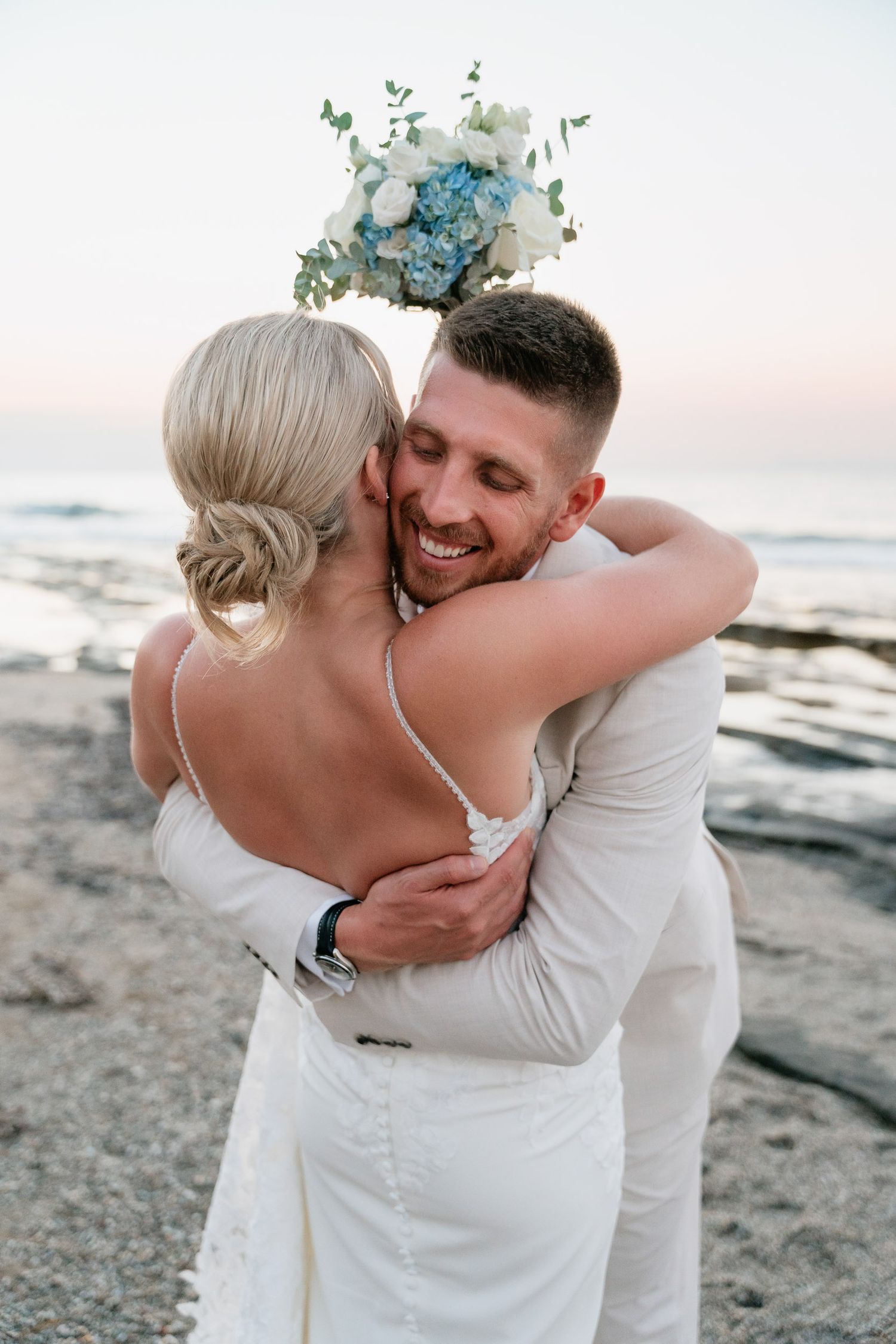 A romantic beach photo sequence shows a couple in white embracing and sharing intimate moments by the ocean at sunset.