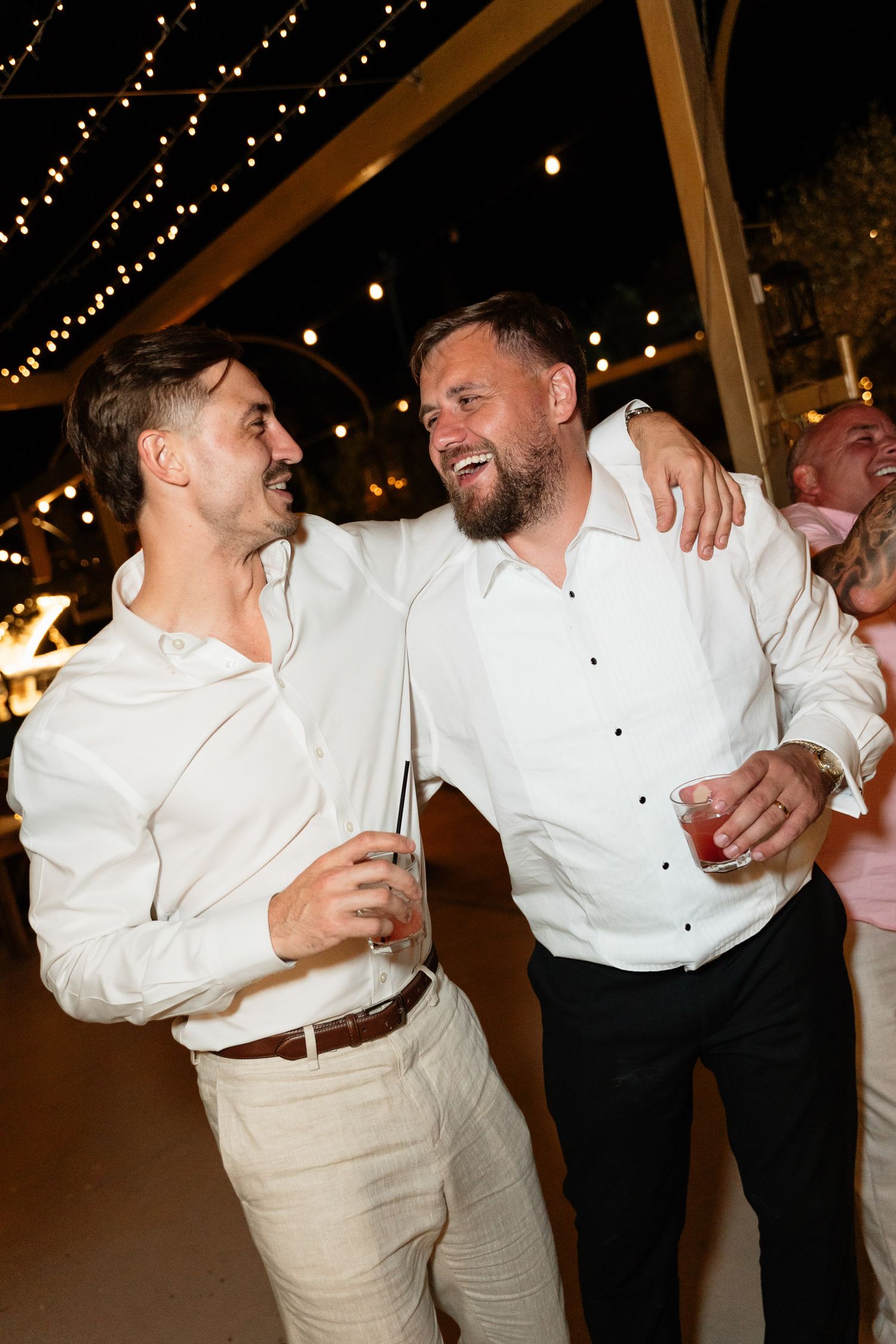 A sequence of candid dance floor moments showing people in white shirts celebrating at a party under twinkling lights.