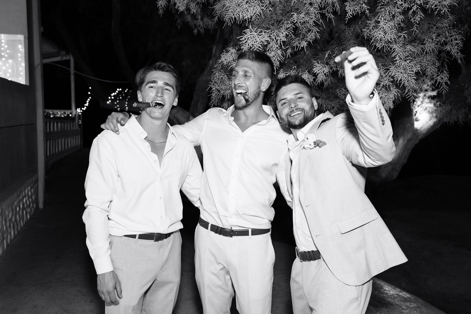 A collection of black and white photographs showing people in white clothing posing together at a social event.