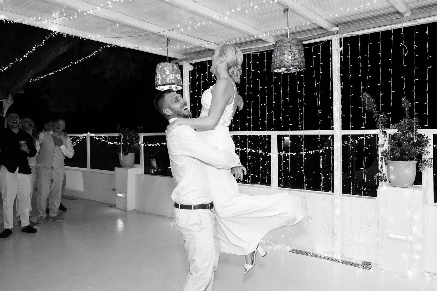 Black and white photographs showing dance floor scenes at what appears to be a wedding reception or celebration event.
