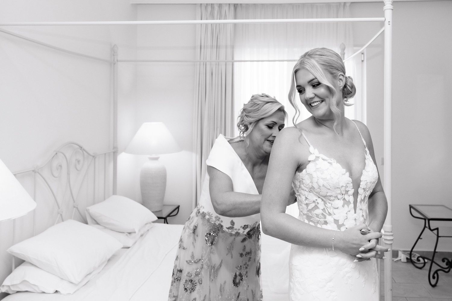 Black and white photo series showing preparations for a wedding with a dress and emotional moments.
