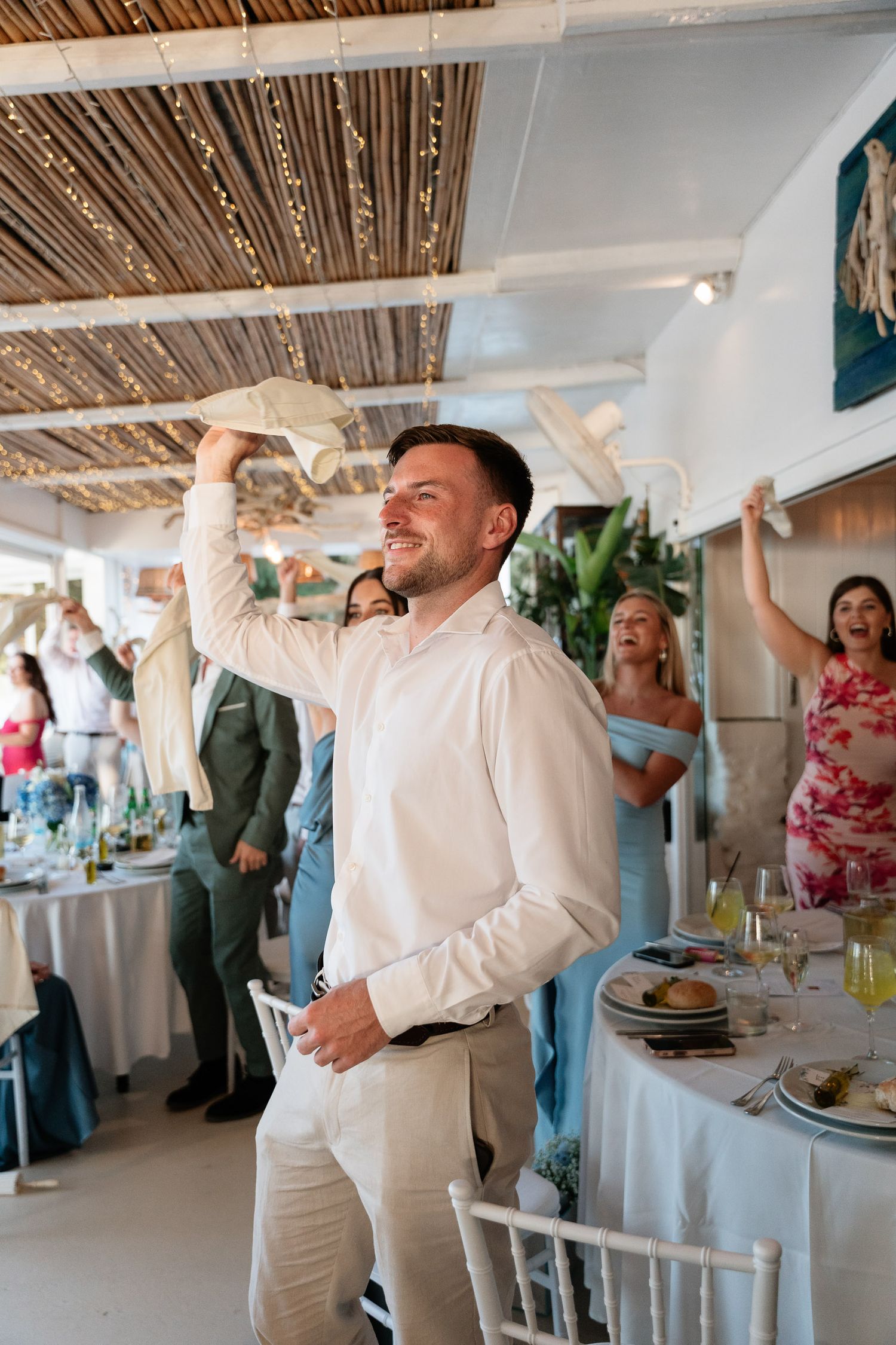 A sequence of five photos shows celebratory moments at a reception with people dancing and enjoying themselves.