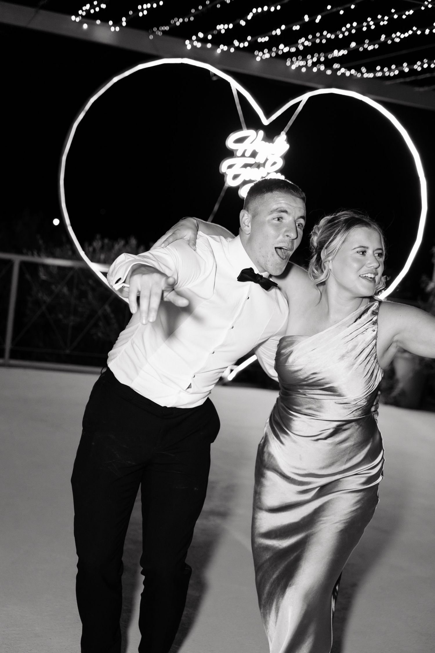 Black and white sequence of dance partners performing a dramatic spinning move on a dance floor.