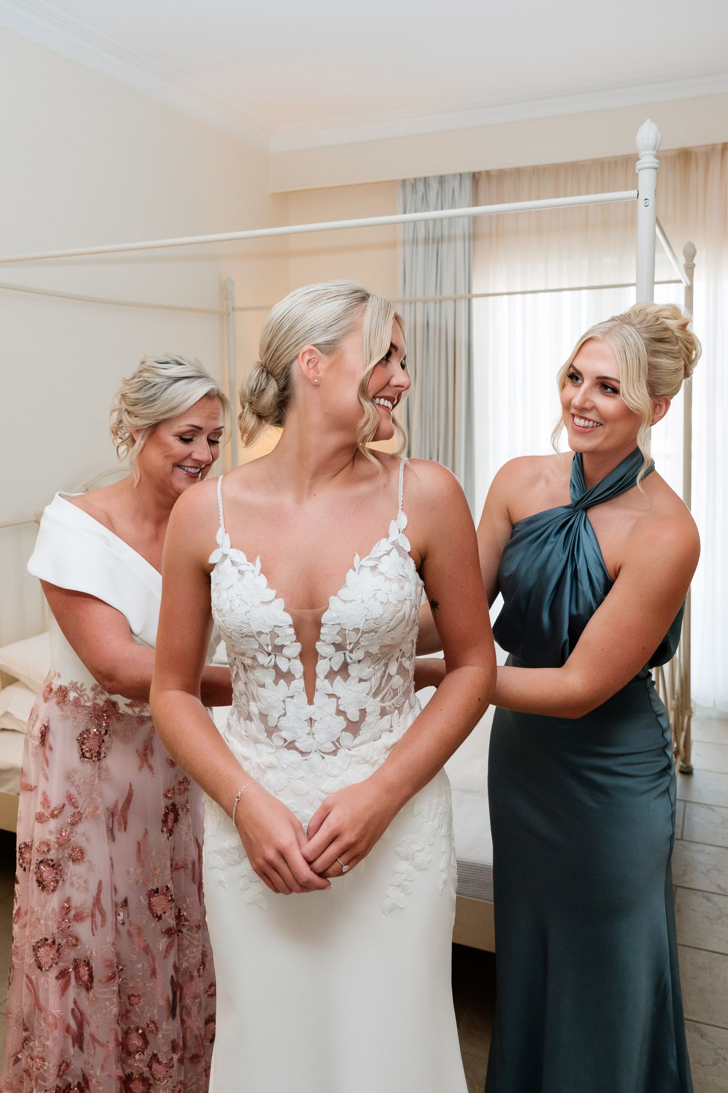 A series of candid emotional moments showing people embracing and sharing joyful reactions during a wedding celebration.