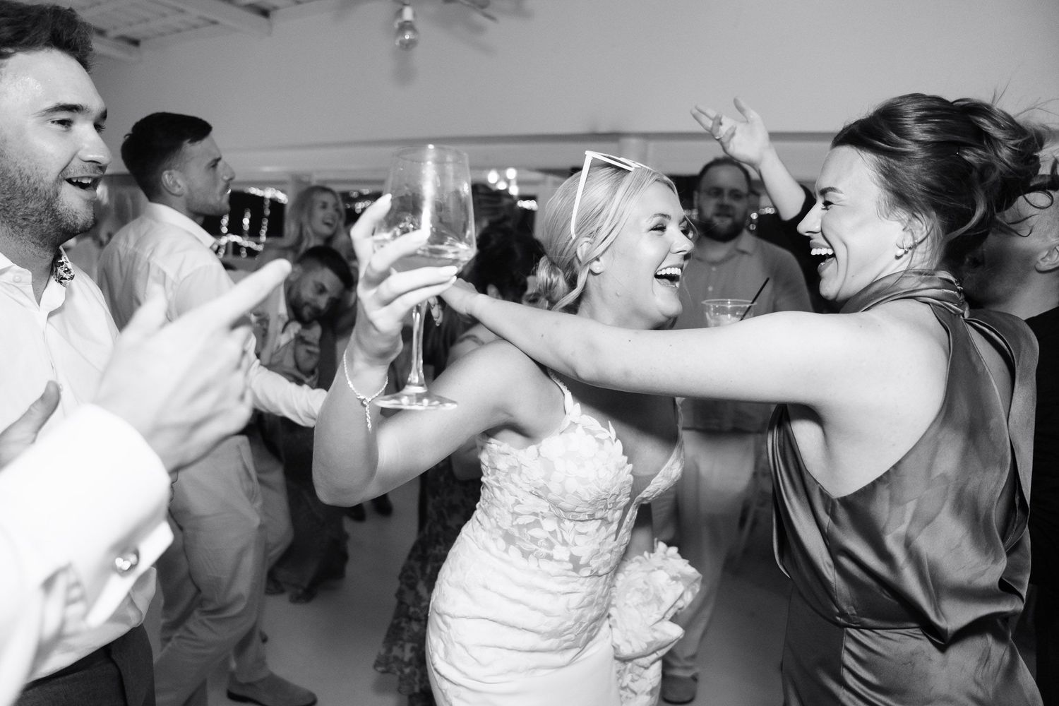 A series of wedding reception photos showing couples dancing and celebrating together on the dance floor.