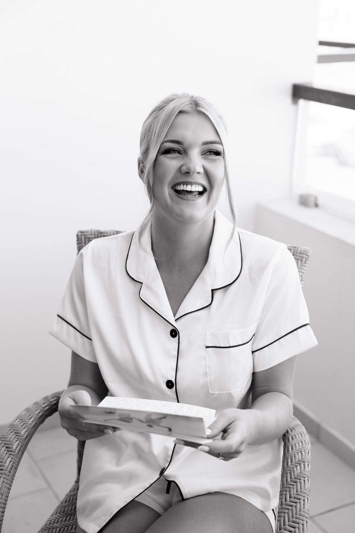 A series of four photos showing someone in white professional attire sitting and smiling in a bright interior setting.