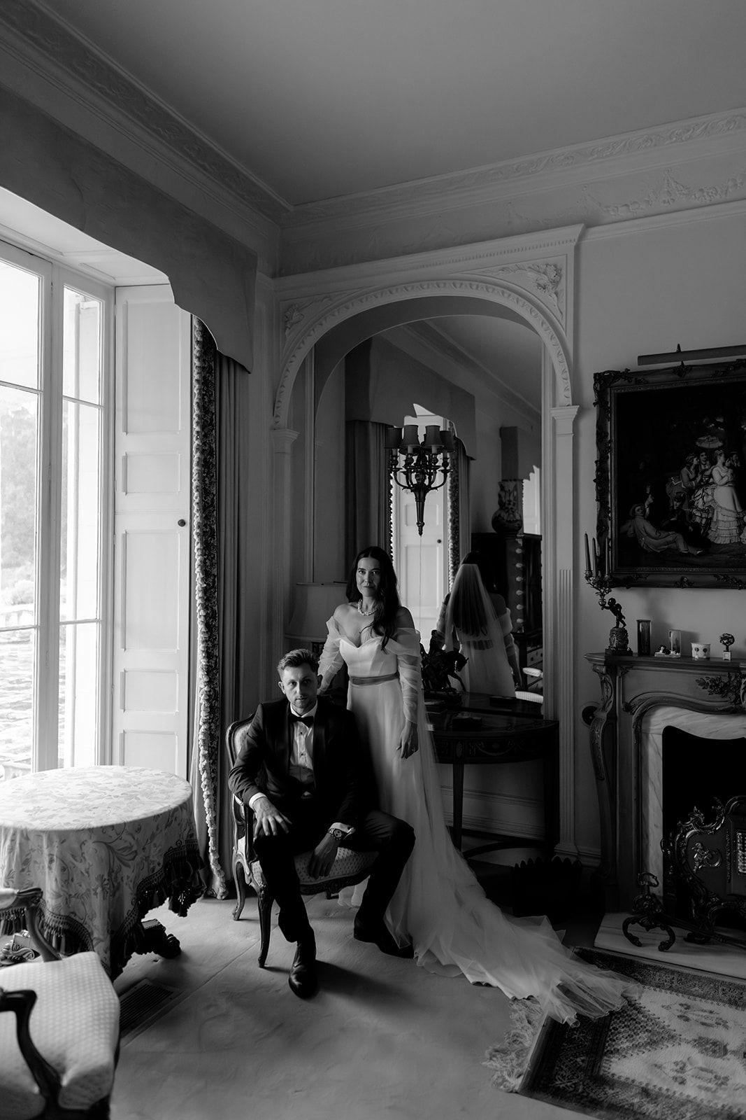 Elegant black and white wedding party photos taken in a classic interior setting.