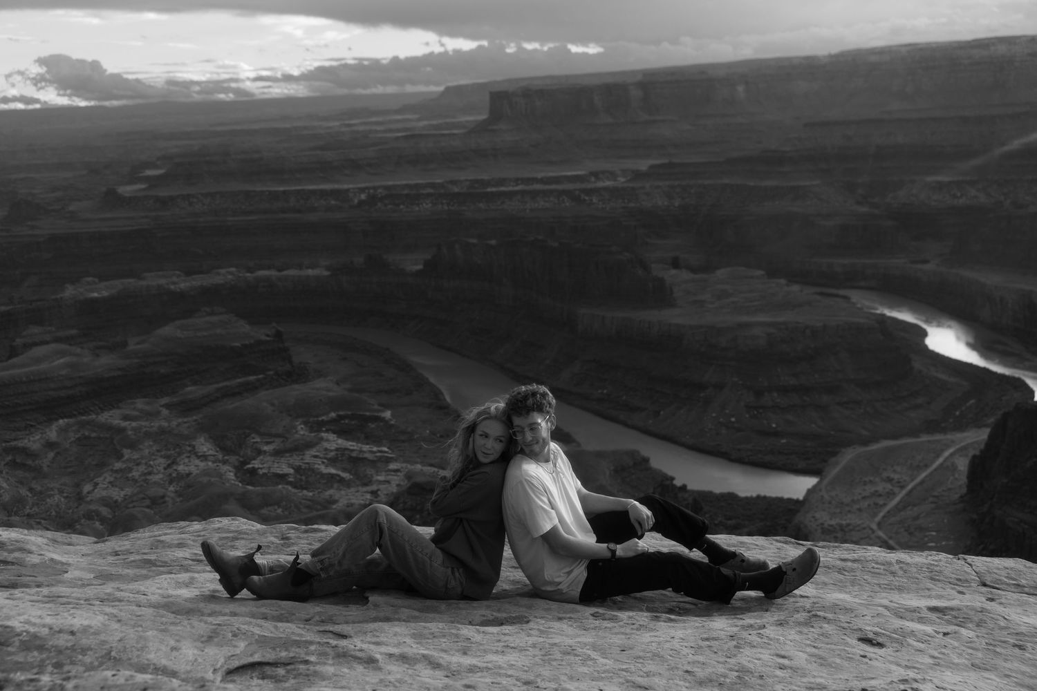 A scenic black and white panoramic view of rolling hills and valleys stretches across multiple connected landscape images.
