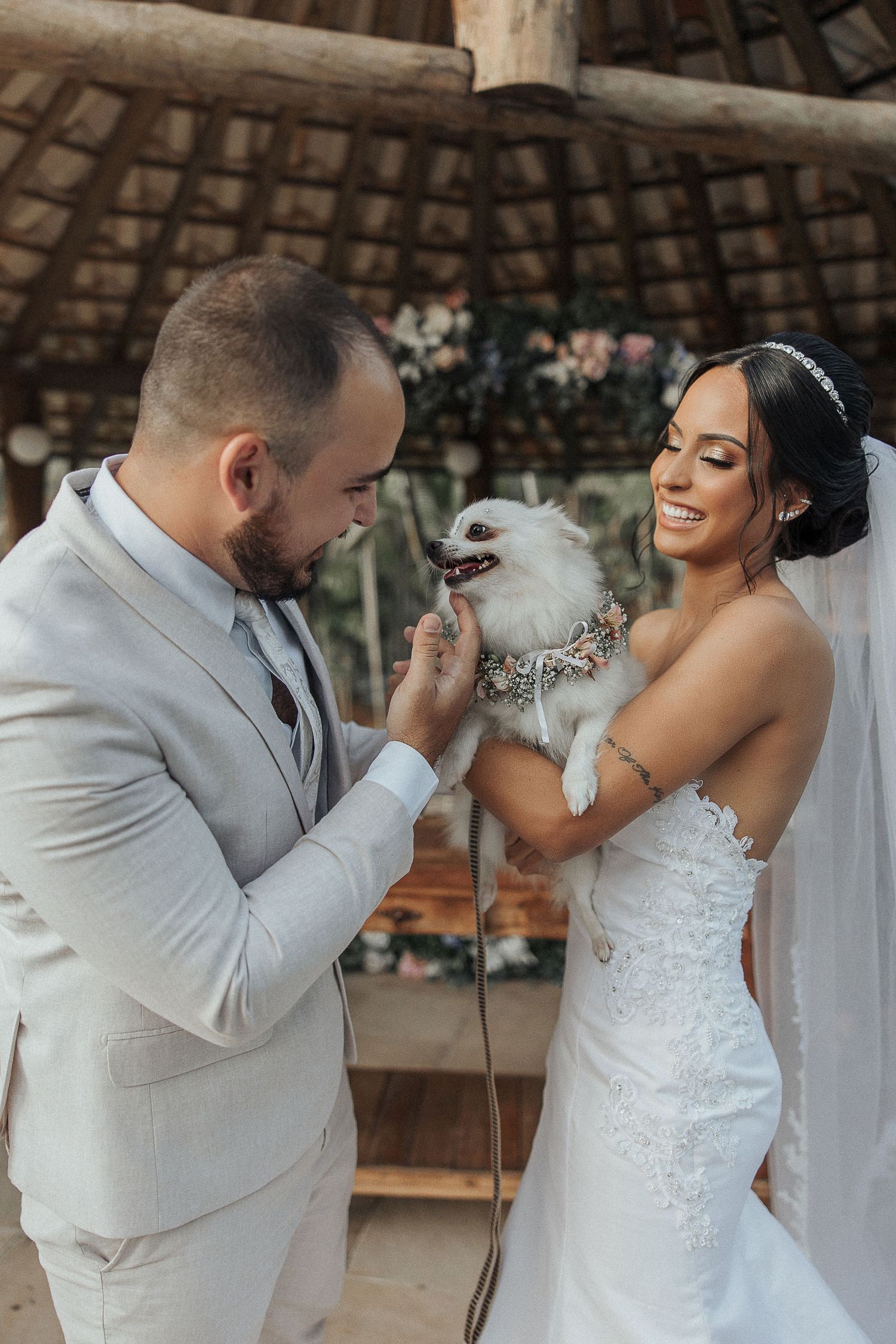 A romantic wedding photoshoot sequence showing a couple sharing playful moments in a rustic venue.