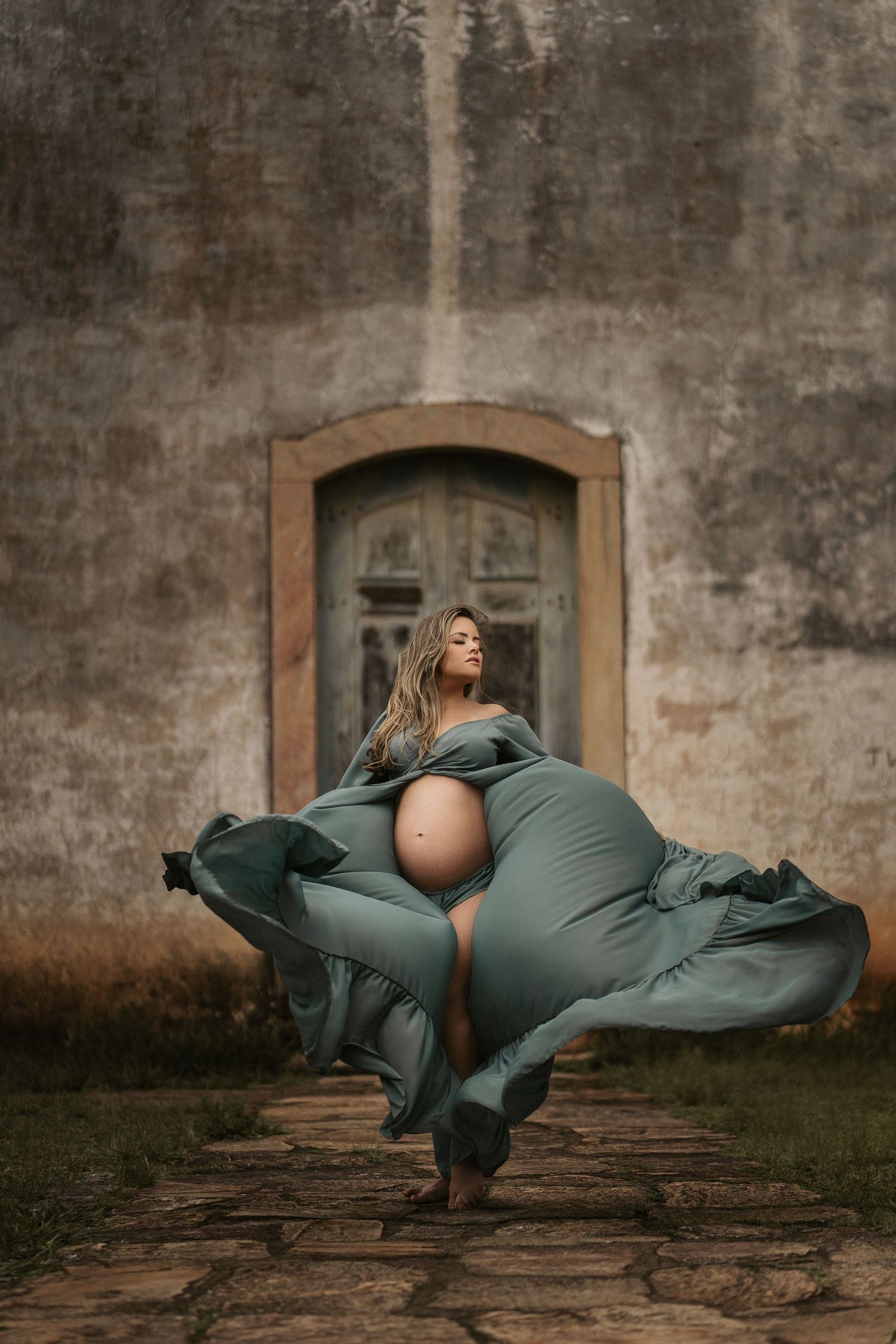 Artistic dance photography sequence showing graceful movement in front of rustic stone wall.