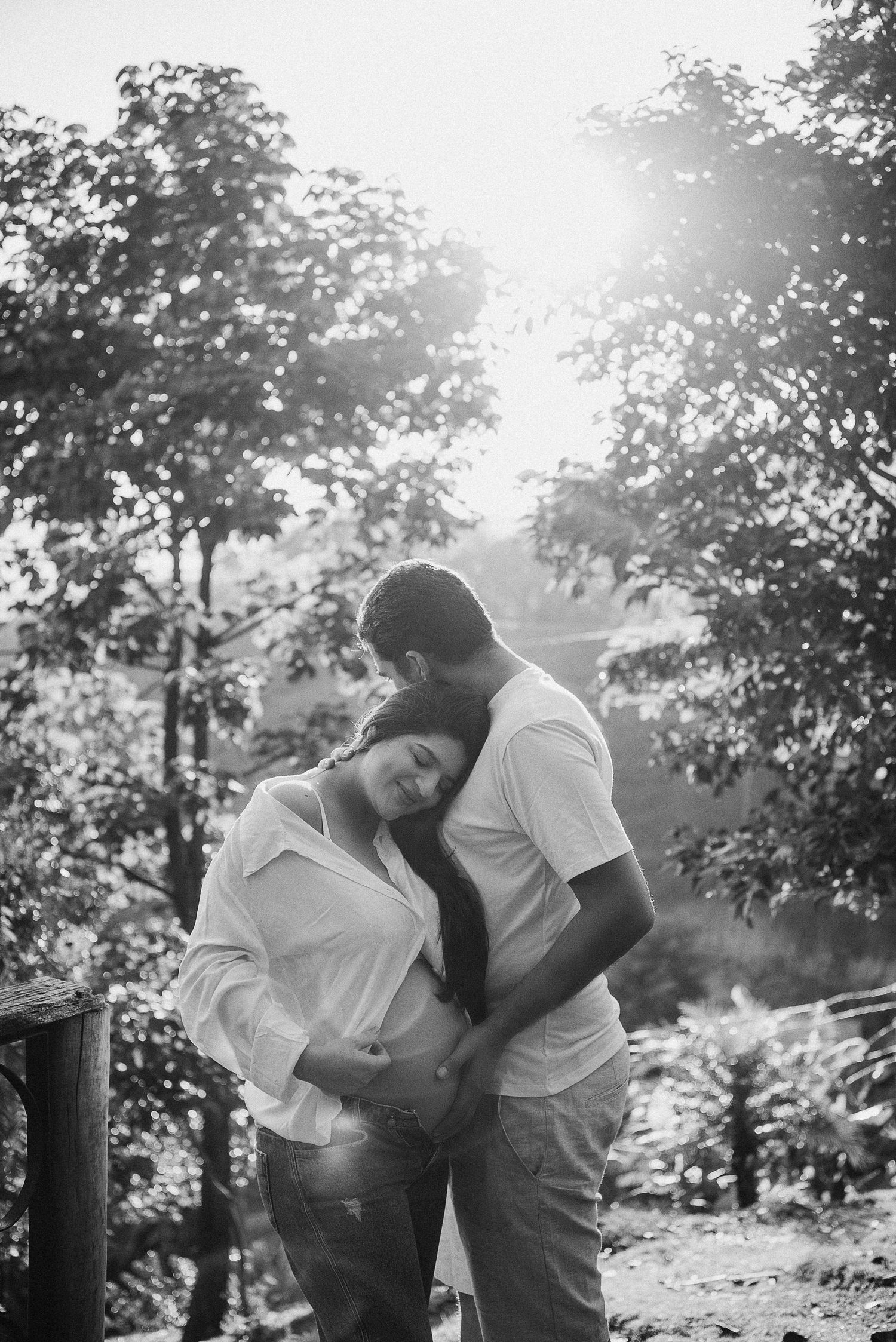 A romantic black and white photo sequence shows a couple embracing in a sunlit garden setting.