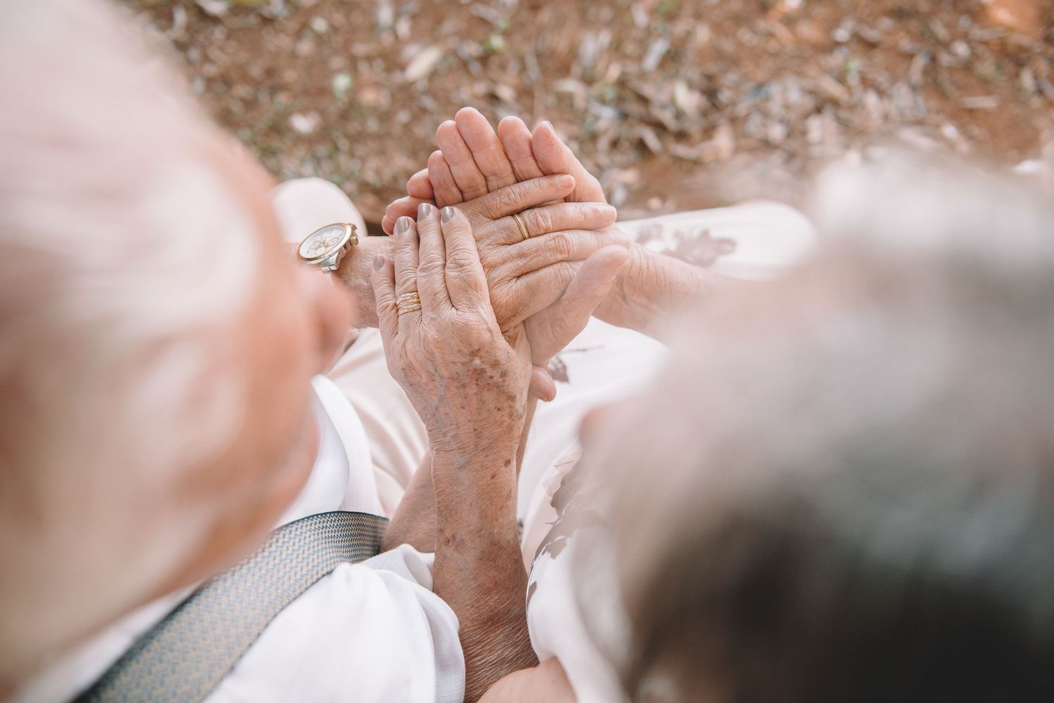 Close-up of hands joining together in unity and support.