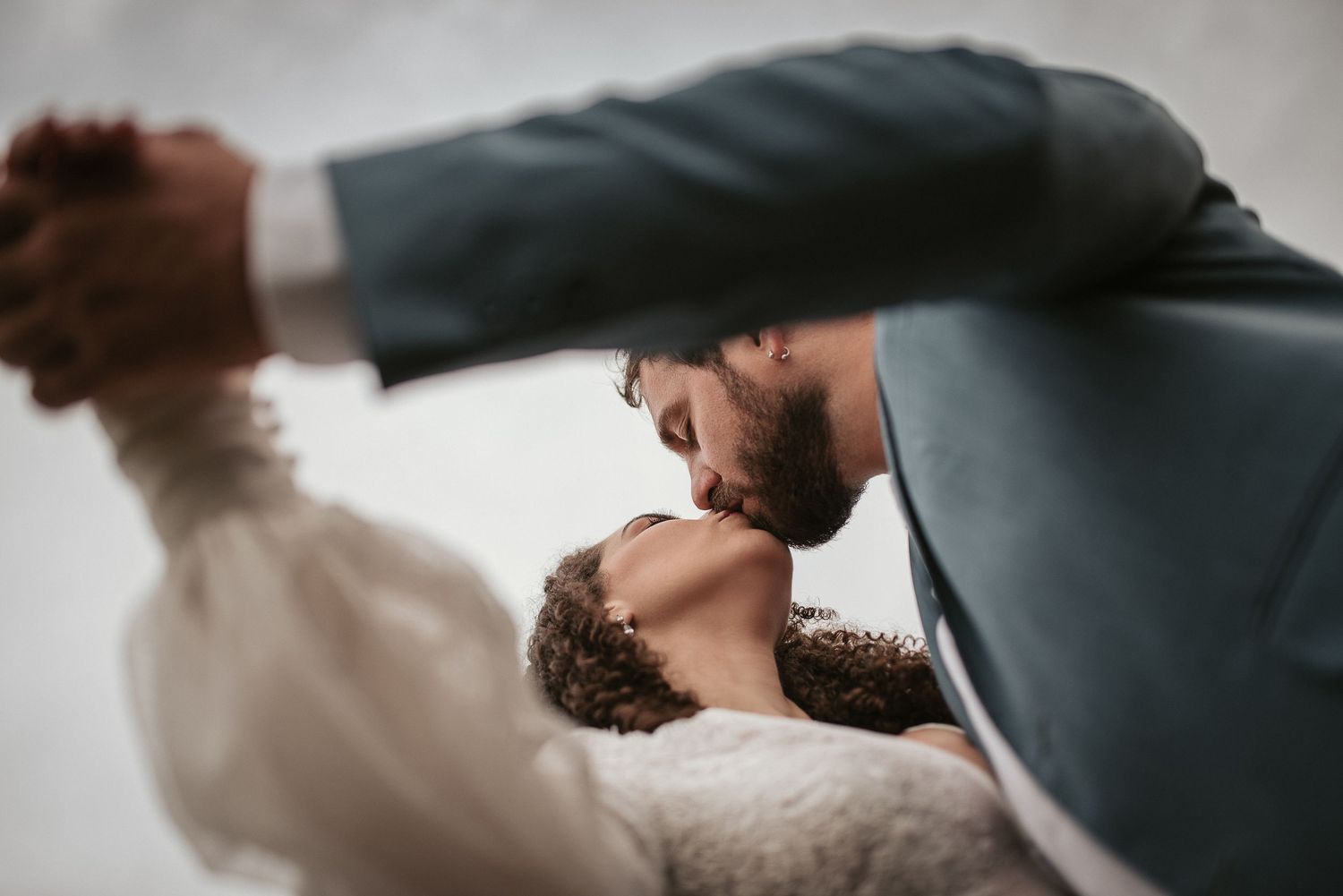 Intimate wedding moment captured in artistic black and white photography.
