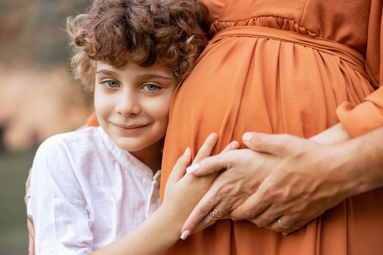 Children in orange outfits playing and interacting during a special occasion.