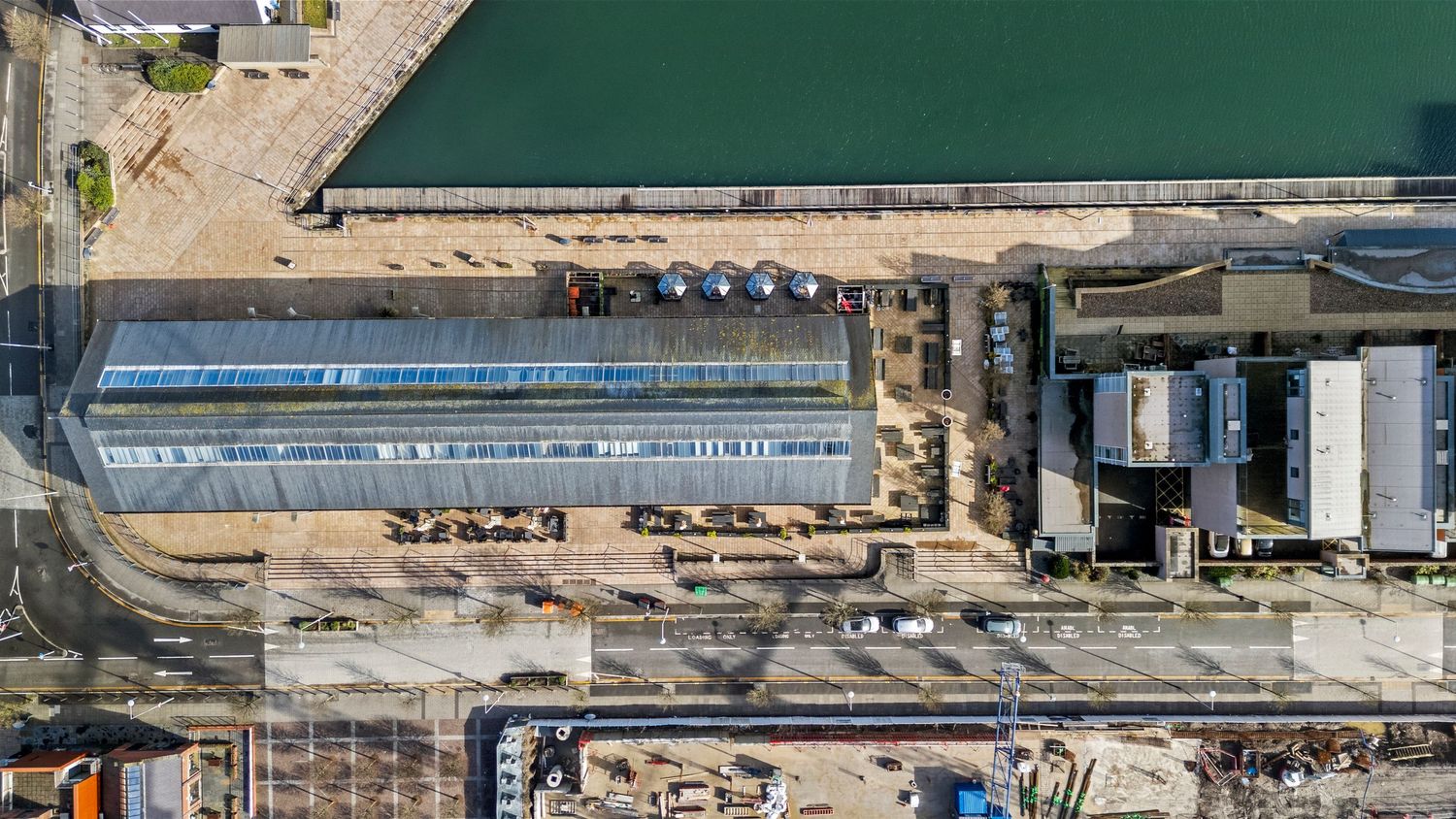 Bird's eye view of industrial port infrastructure and waterway. SA1, Swansea, South Wales.