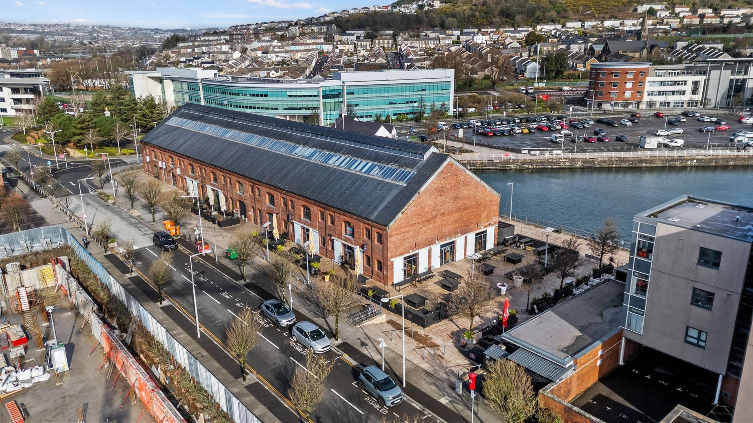 Historic brick warehouse building converted into modern waterfront development. SA1, Swansea, South Wales.