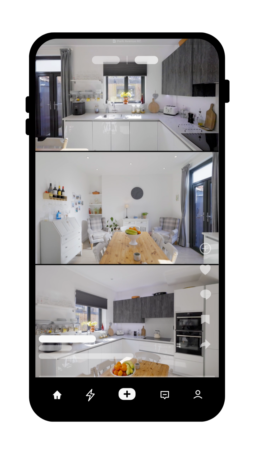 Modern white kitchen and dining area featuring sleek cabinetry, wooden table, and contemporary lighting.