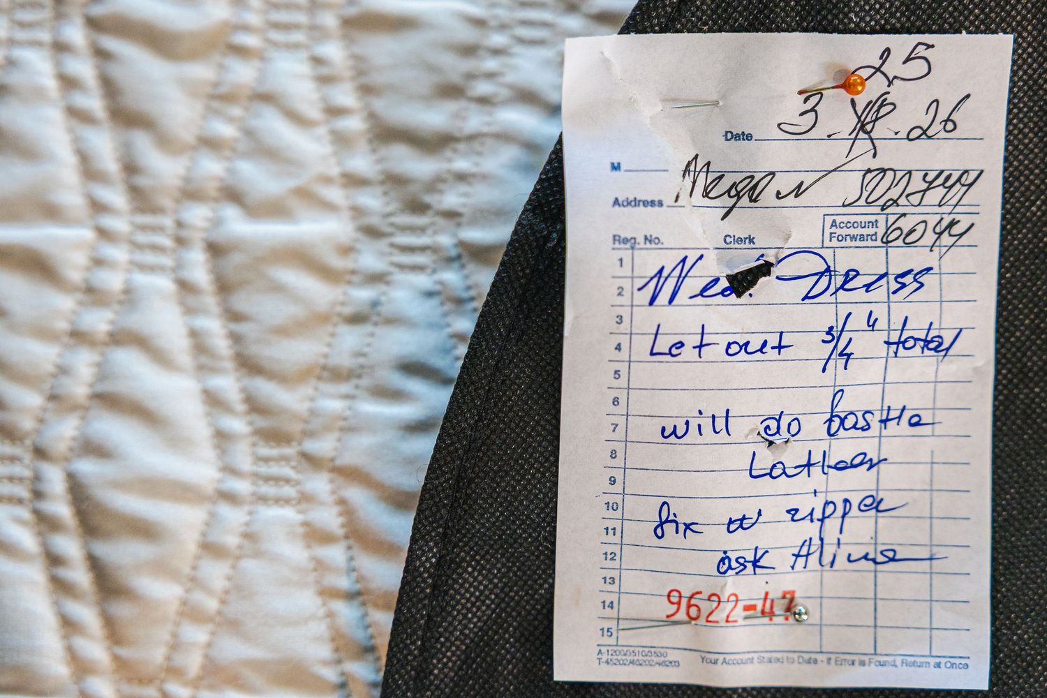 Handwritten alteration ticket on white fabric noting dress let out 3/4 total, will go to Boston, ask Alina for zipper.