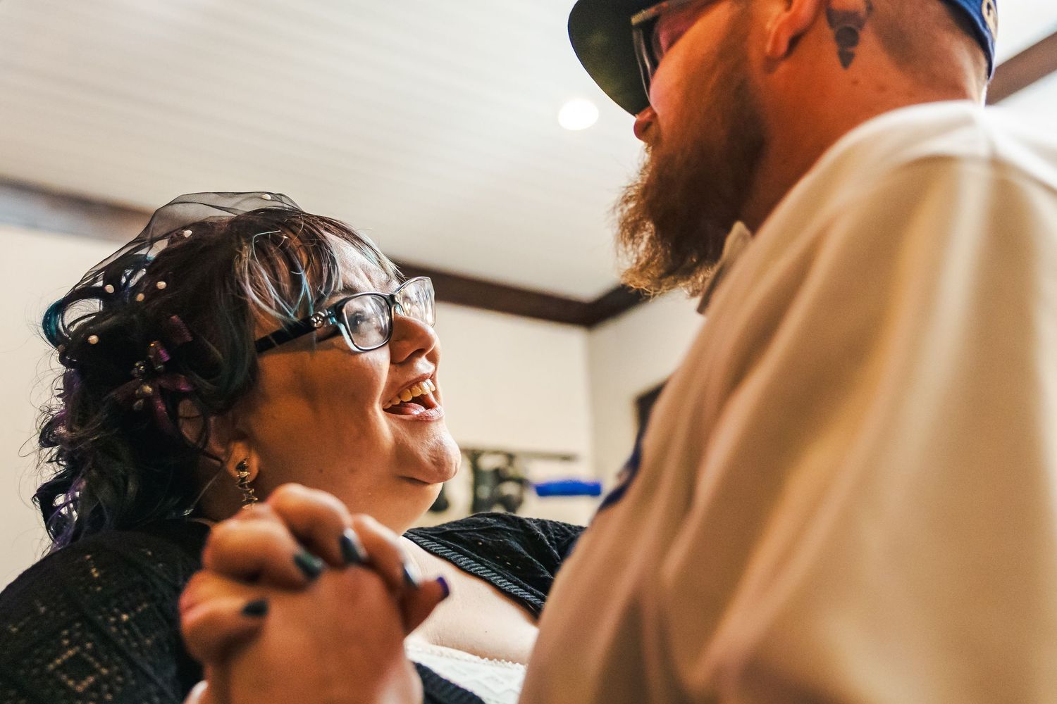 Dental hygienist performing oral examination and cleaning on patient in modern dental office.