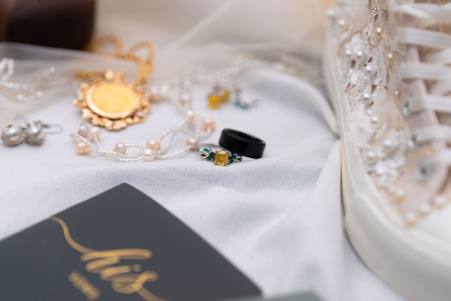 Wedding reception table details with crystal decorations and elegant place settings.