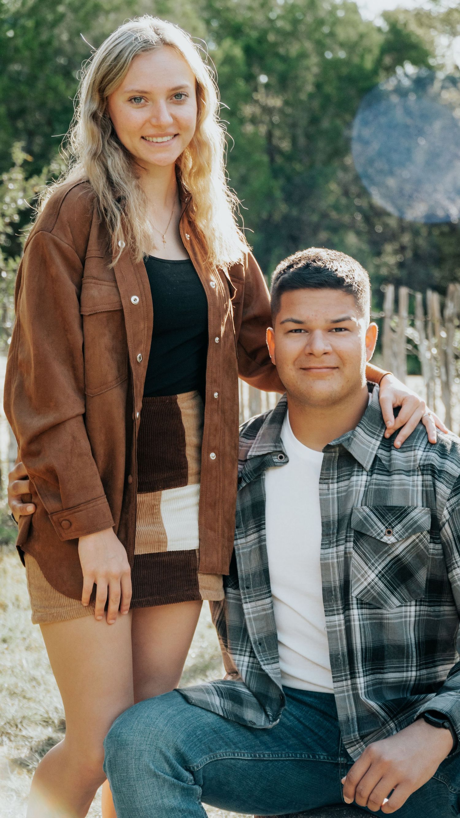 Casual outdoor portrait session featuring couple in autumn clothing.