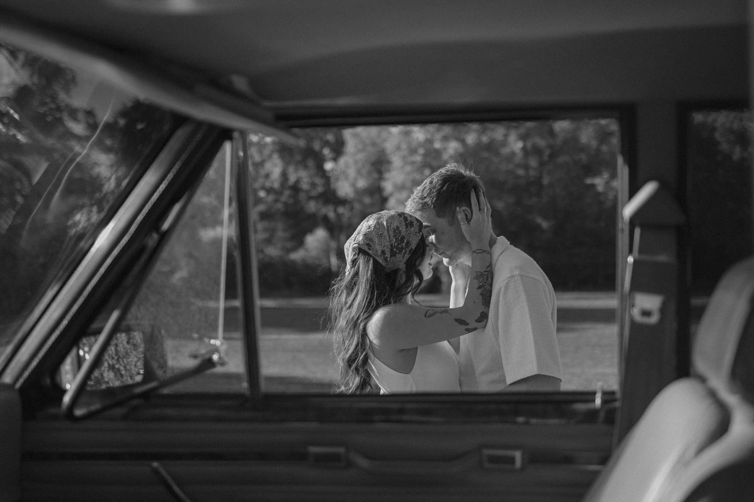 A series of black and white film frames showing someone in a car, creating a cinematic sequence.