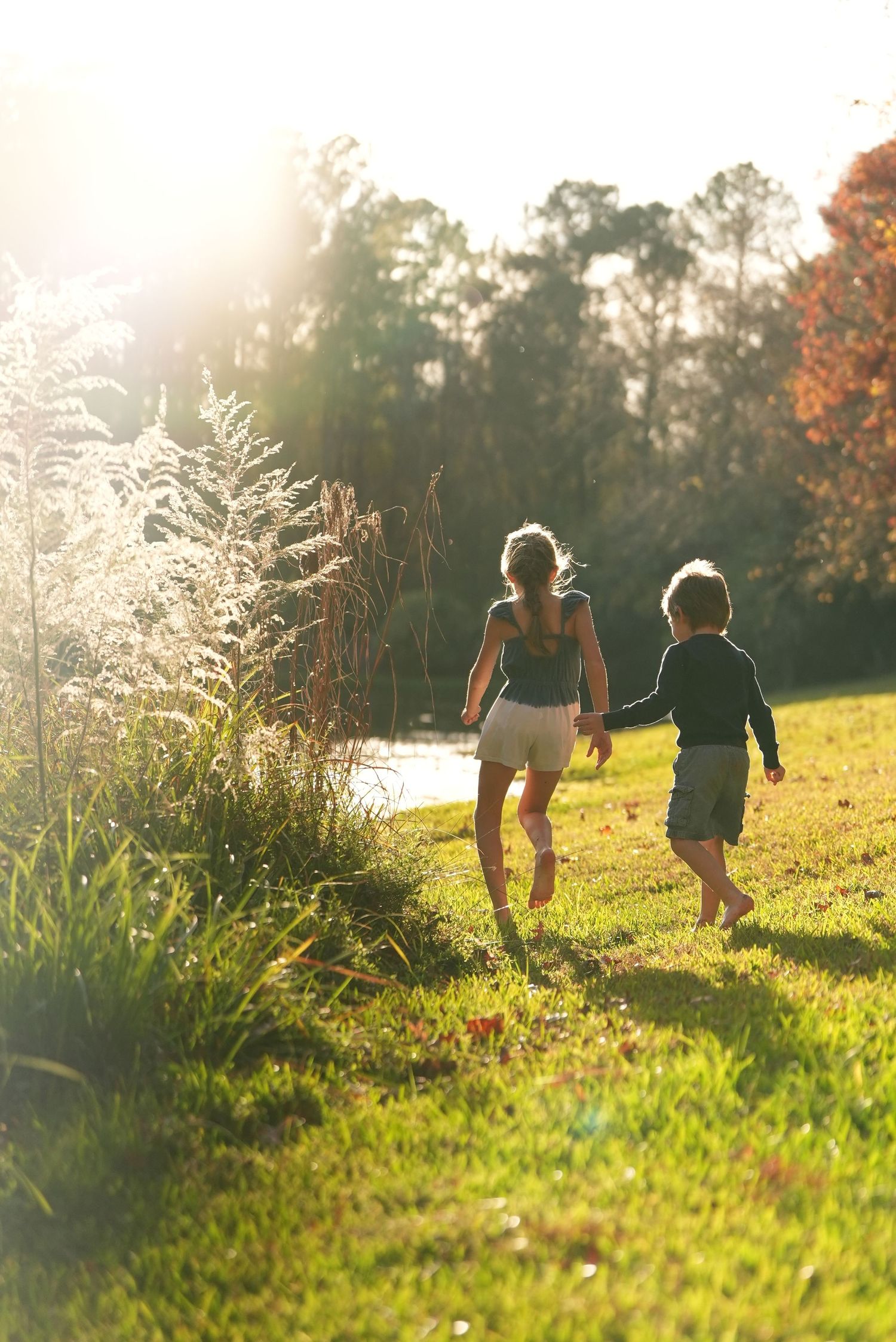 Kids running to the sunset