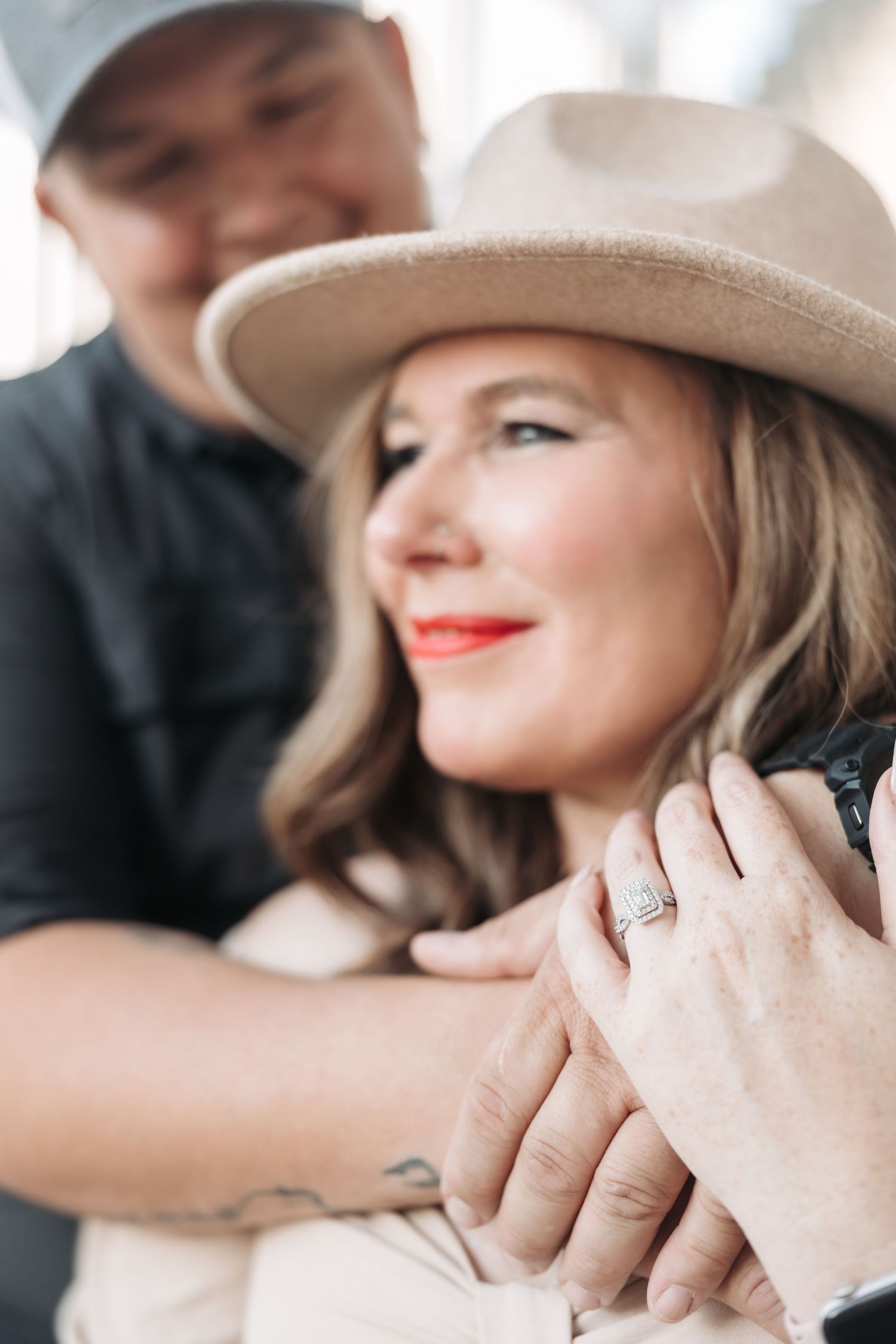A romantic moment captured between two people in casual western attire.