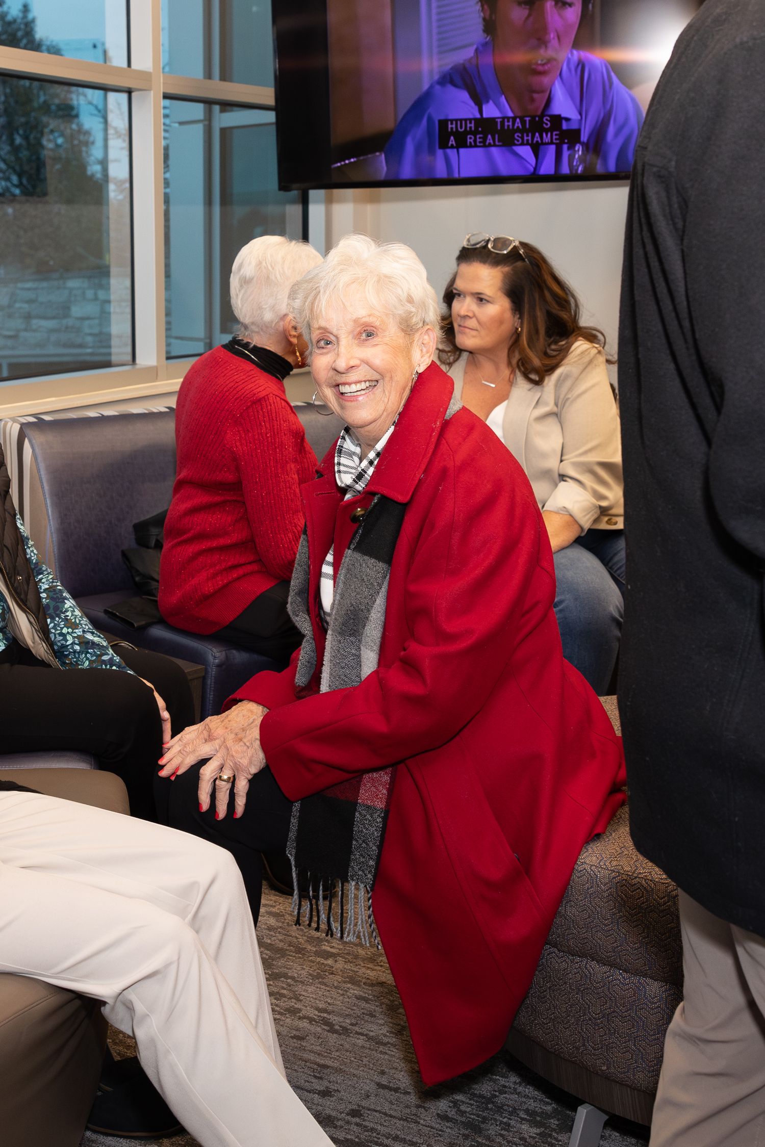 Celebration attendees gathered in an office lounge area during event.