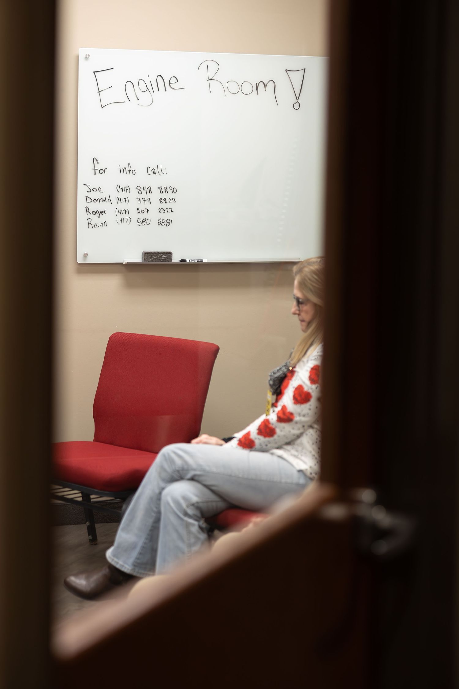 Room with whiteboard labeled 'Engine Room' viewed through doorway.