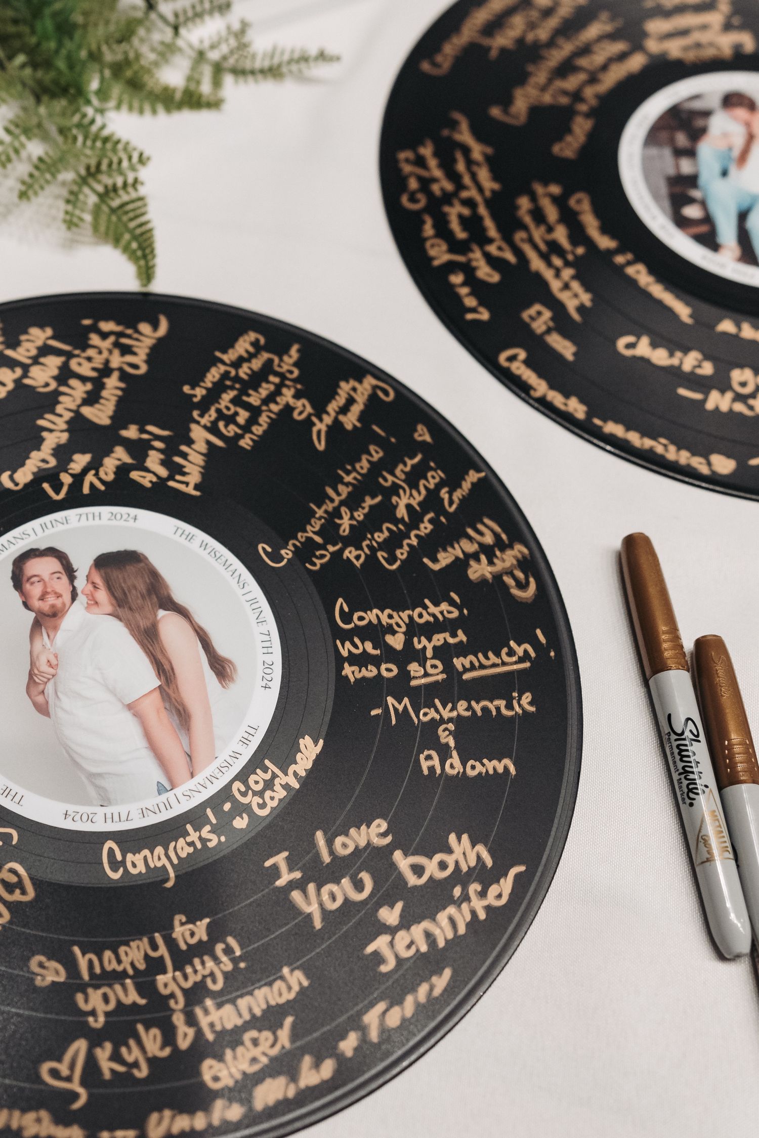 Wedding guest book made from vinyl records with handwritten messages.