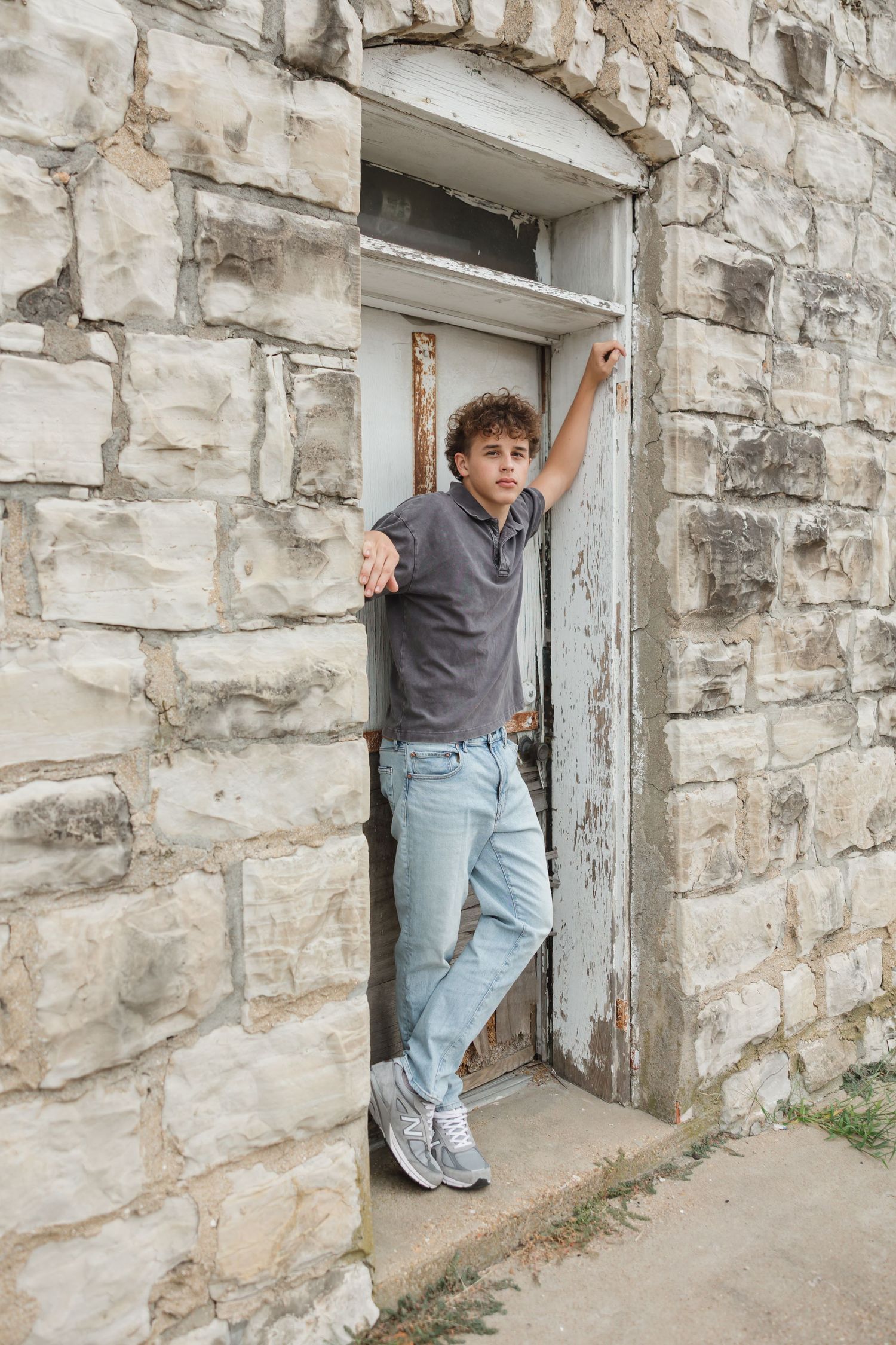 Three sequential photos showing someone opening a weathered stone building door and walking inside.