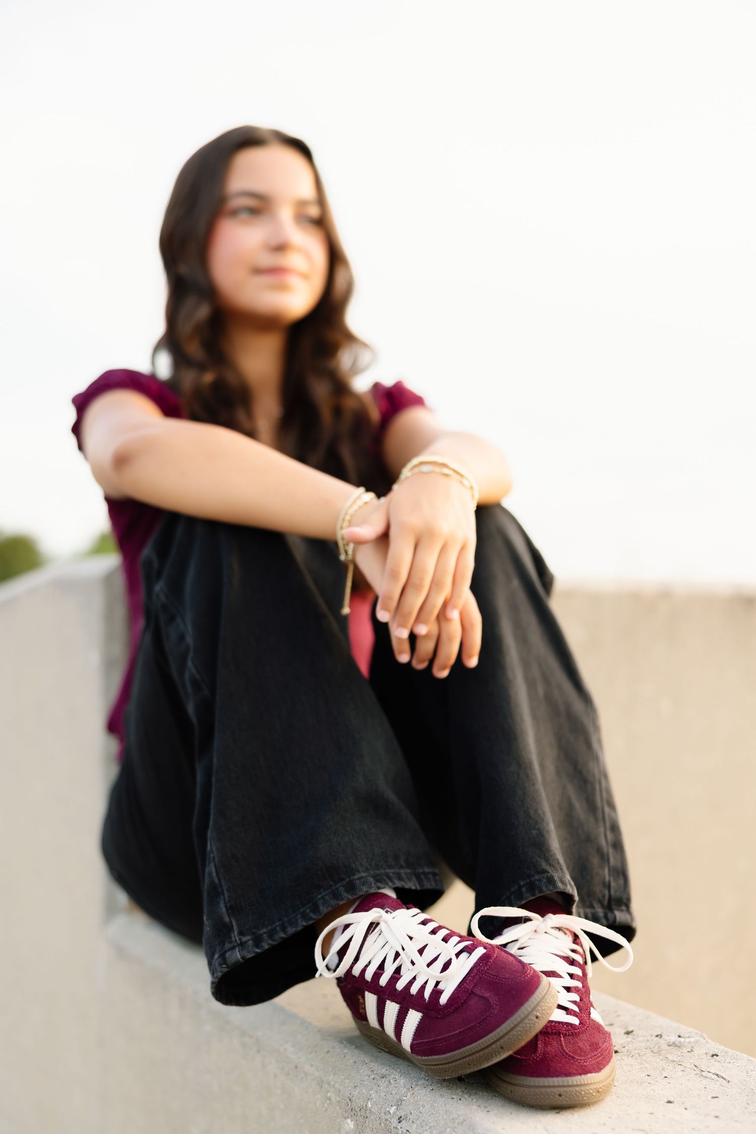 A collection of casual portraits showing maroon sneakers against a white backdrop.