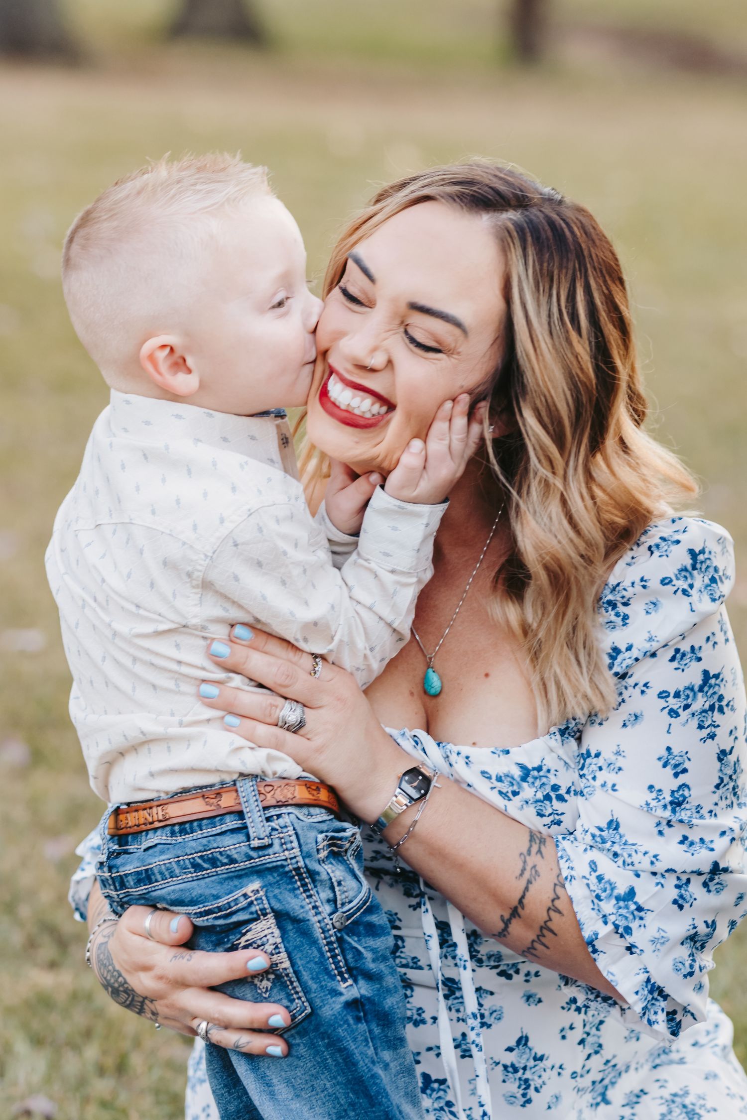 Sweet moment shared between parent and child in casual outdoor setting.