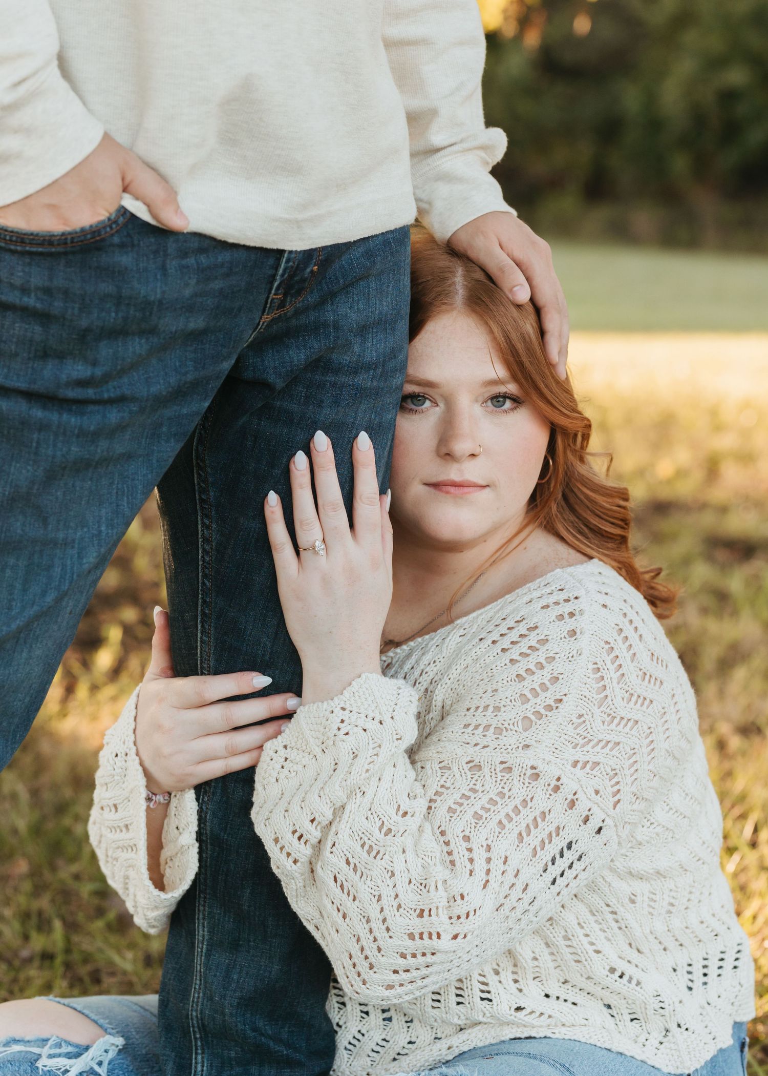 Close up portrait in a white knit sweater during a golden hour photo session.