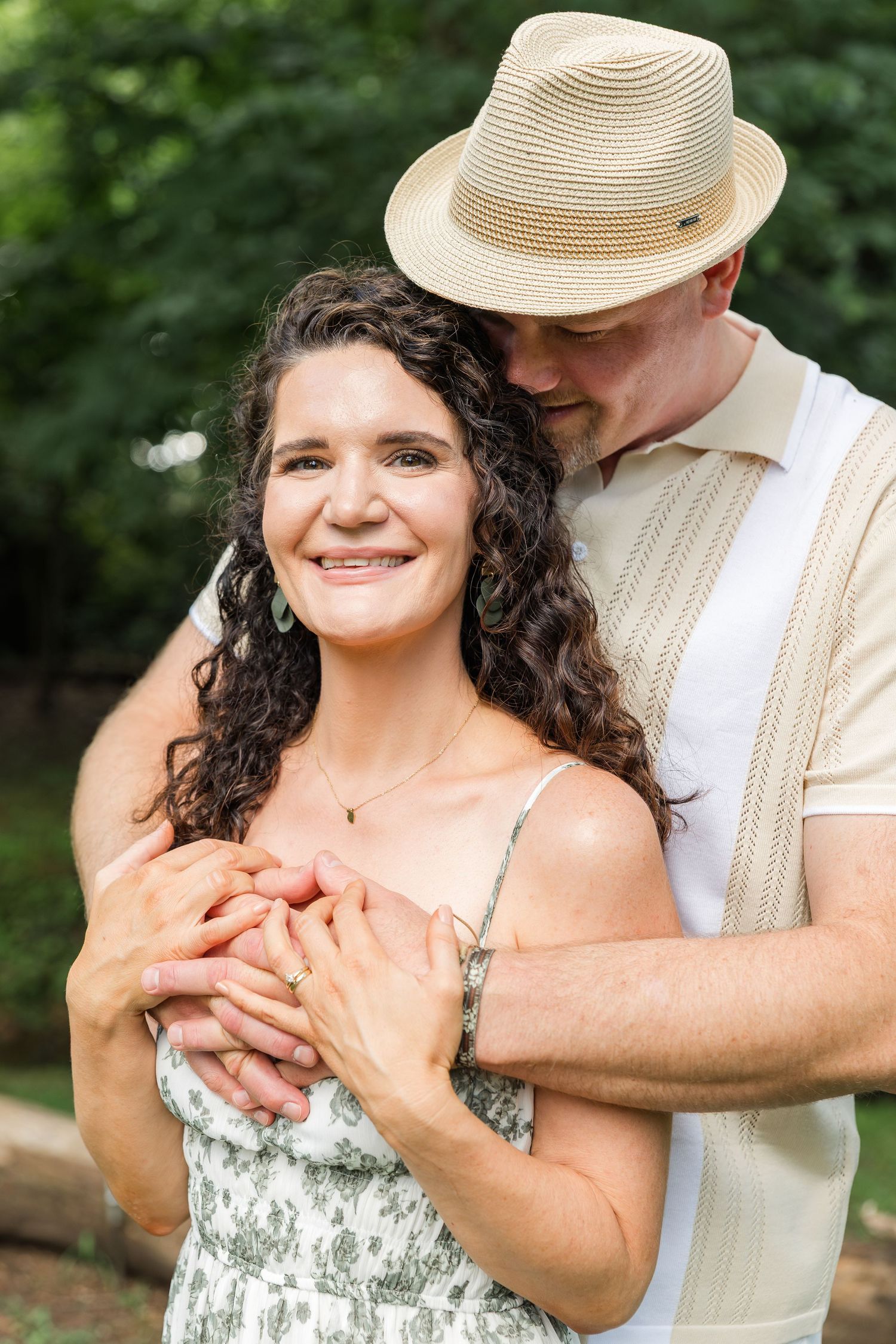 A tender engagement photo sequence shows a couple embracing outdoors in natural lighting with a straw hat and floral dress.