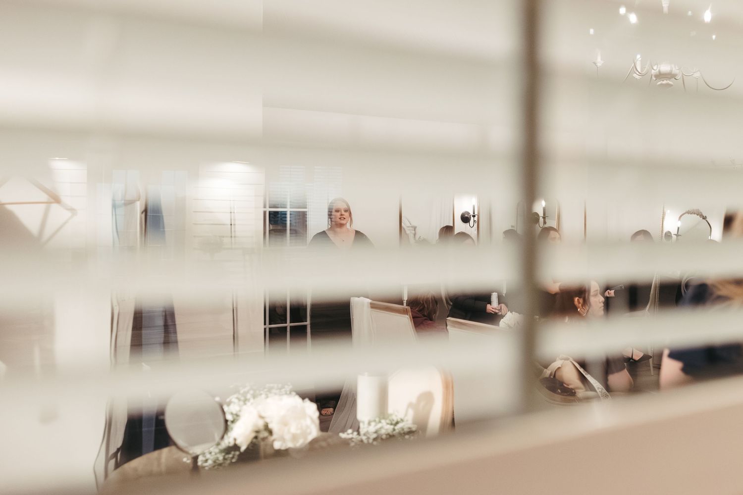 An artistic blurred reflection of a wedding scene captured in a mirror.