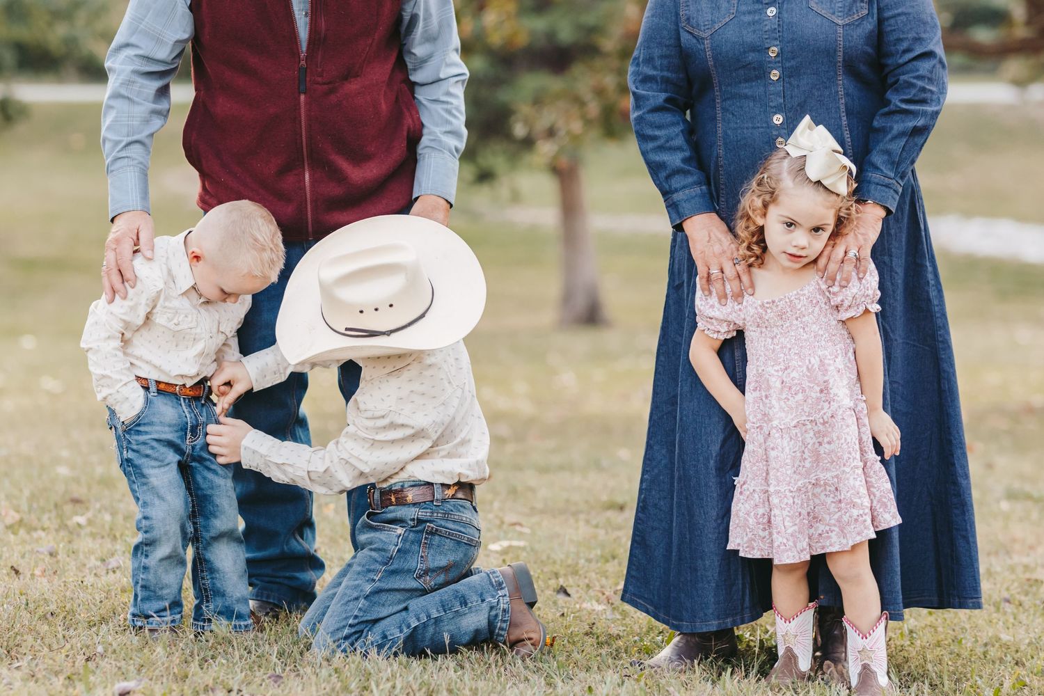 Two groups pose casually during an autumn outdoor photo session.