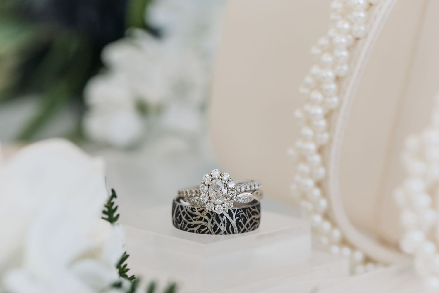 Detailed close-up of vintage-style diamond wedding rings with intricate band designs.