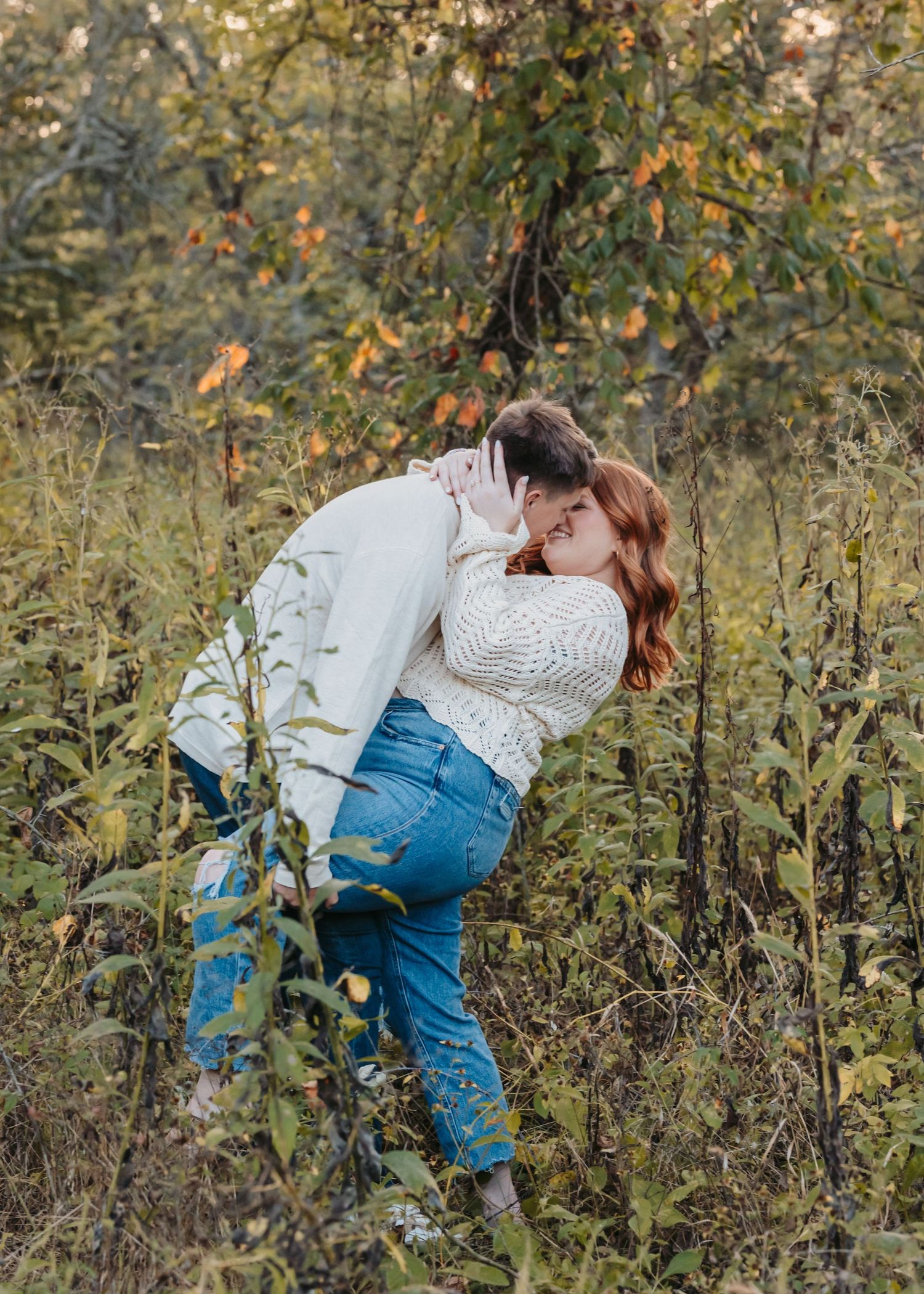 Intimate moment captured in a field of wildflowers at golden hour.