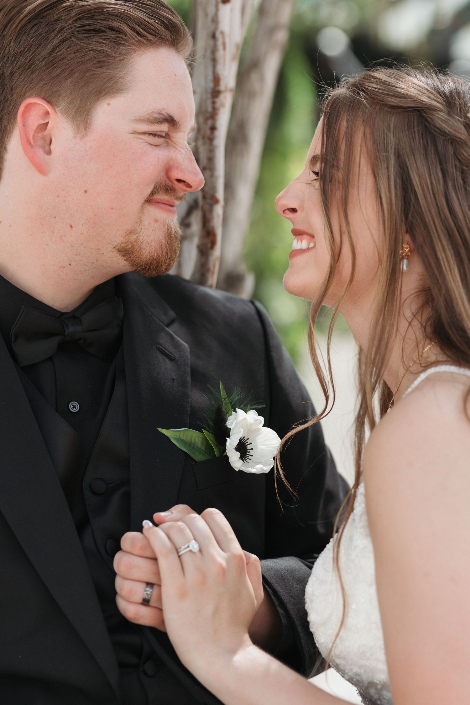 Intimate wedding portrait capturing couple's laughter and joy.