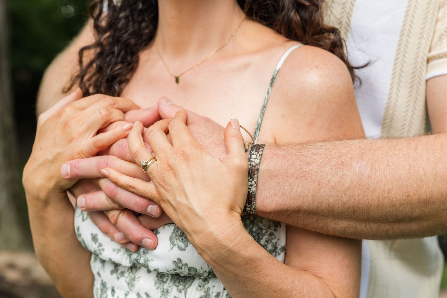 Close-up shot of hands holding and caressing each other tenderly during an intimate moment.