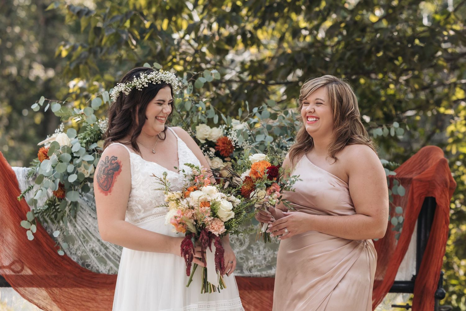 Wedding ceremony moment with natural outdoor backdrop.